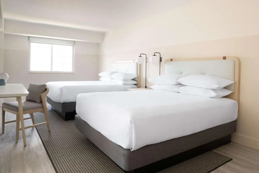 Studio with two beds and desk at Hampton by Hilton Grand Cayman Seven Mile Beach.