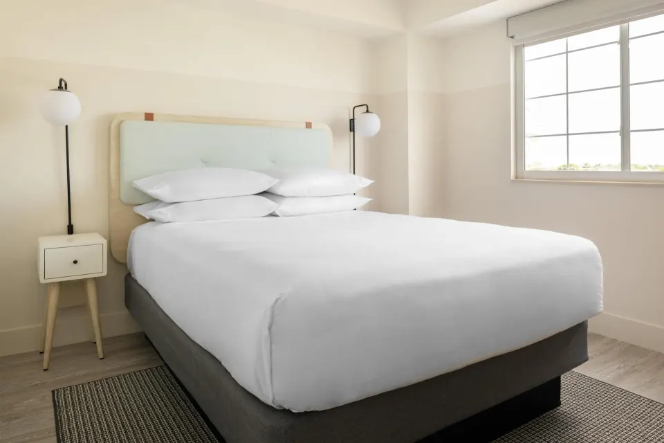 Studio king bed with window at Hampton by Hilton Grand Cayman Seven Mile Beach.