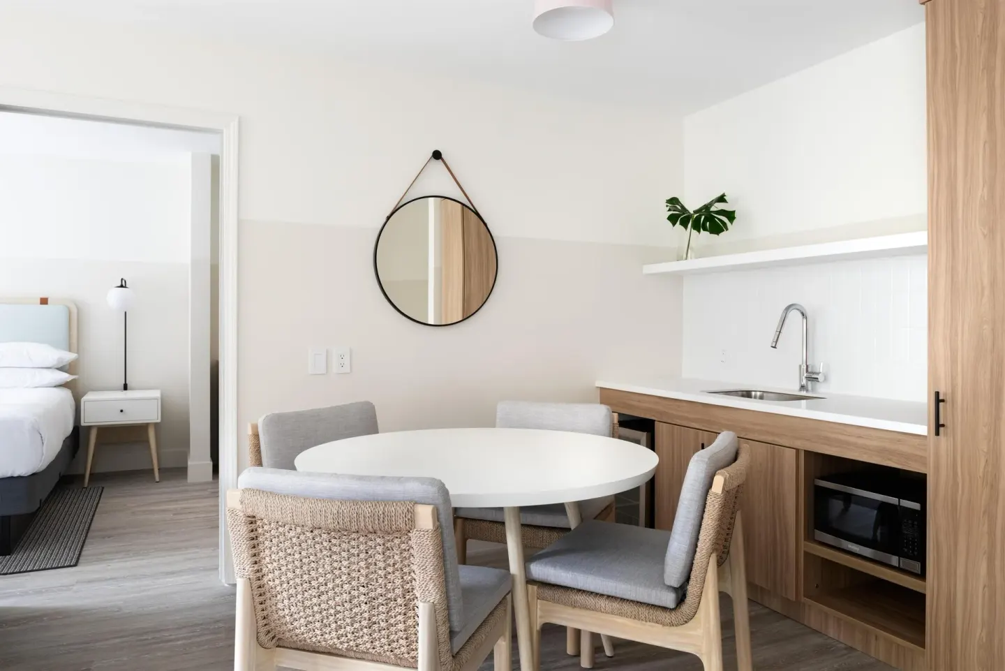 Two-bedroom suite dining nook and kitchenette at Hampton by Hilton Grand Cayman Seven Mile Beach.