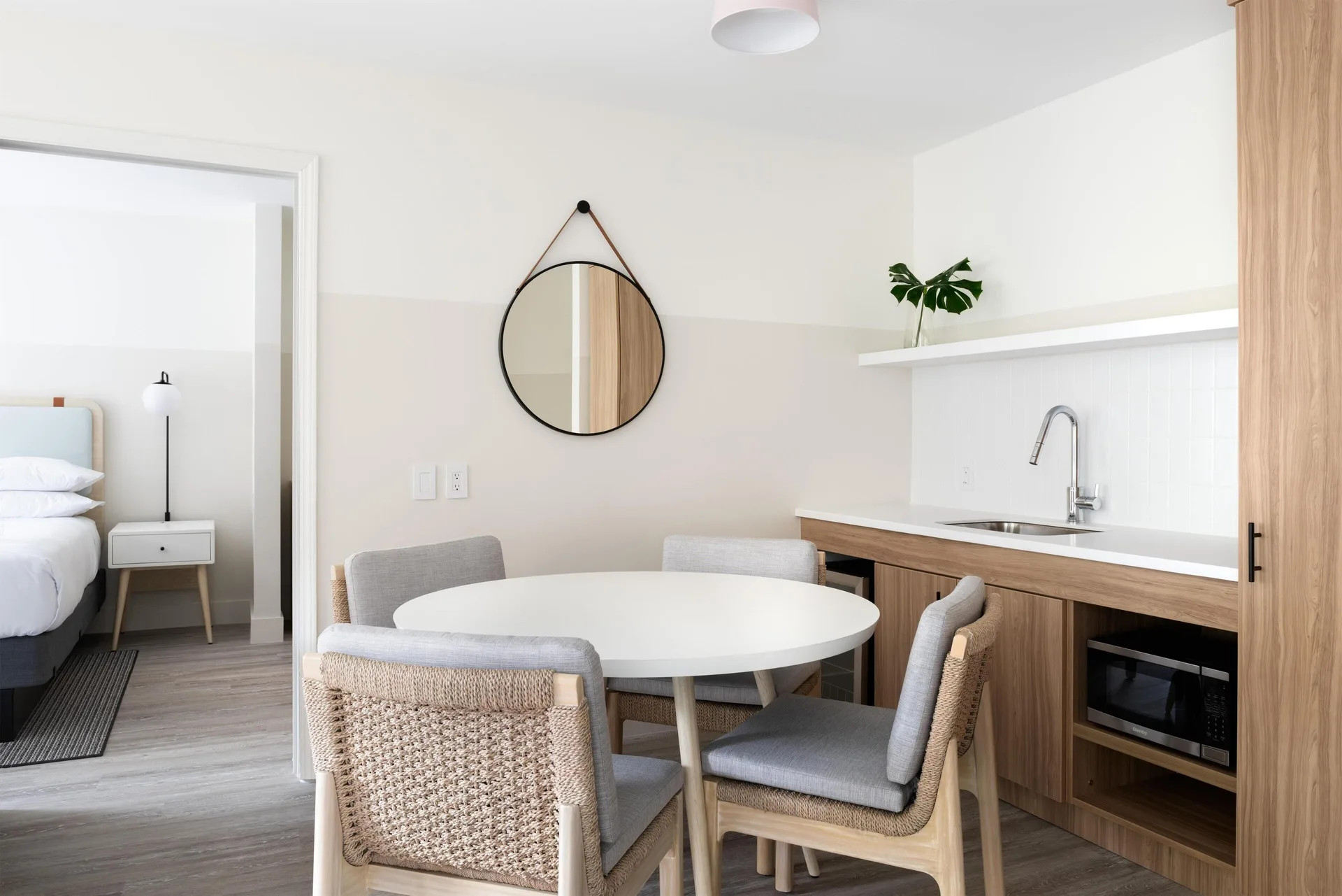 Two-bedroom suite dining nook and kitchenette at Hampton by Hilton Grand Cayman Seven Mile Beach.