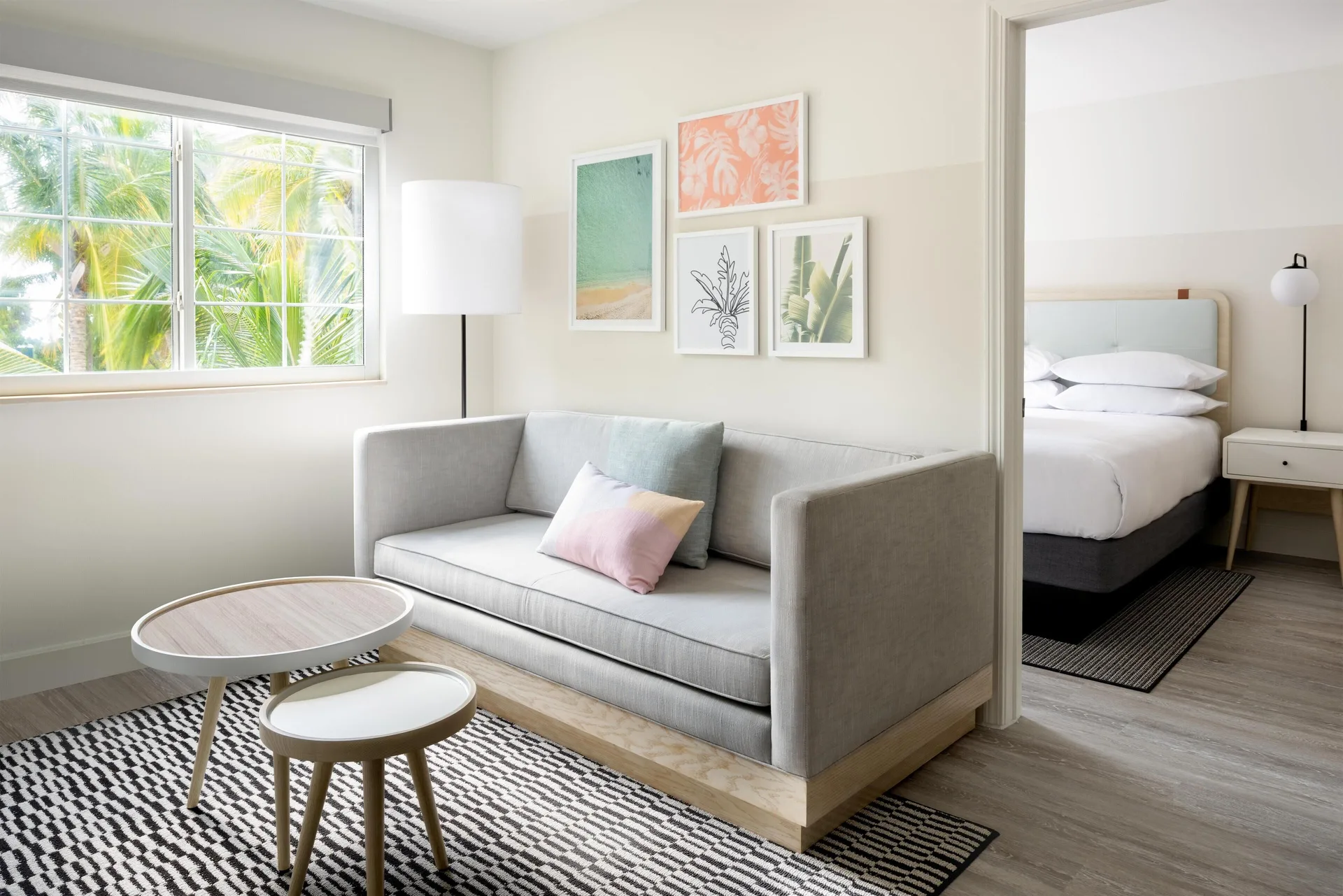 Two-bedroom suite living area and bedroom at Hampton by Hilton Grand Cayman Seven Mile Beach.