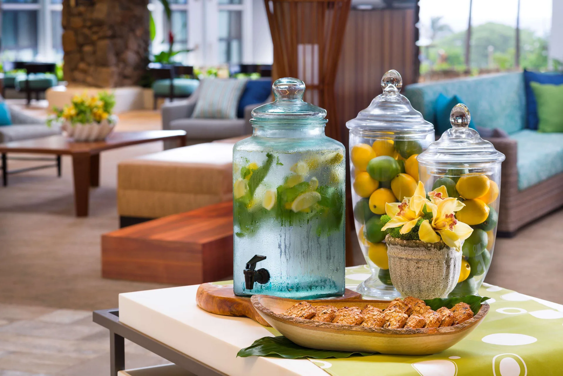 Lobby refreshment display with citrus and seating at Hilton Garden Inn Kauai Wailua Bay.
