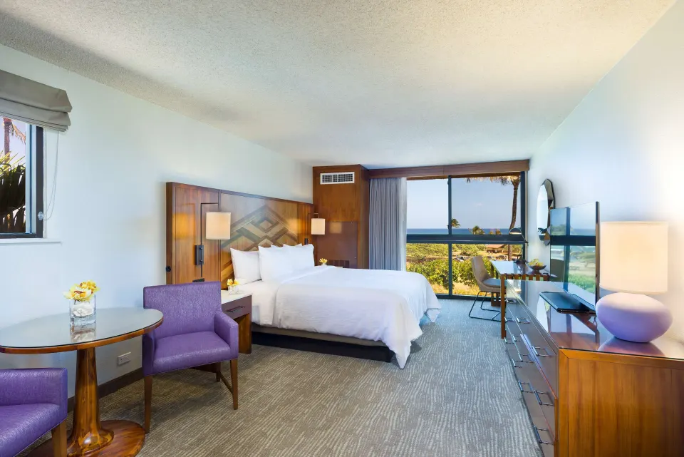 Junior Suite Ocean View king bedroom at Hilton Garden Inn Kauai Wailua Bay.
