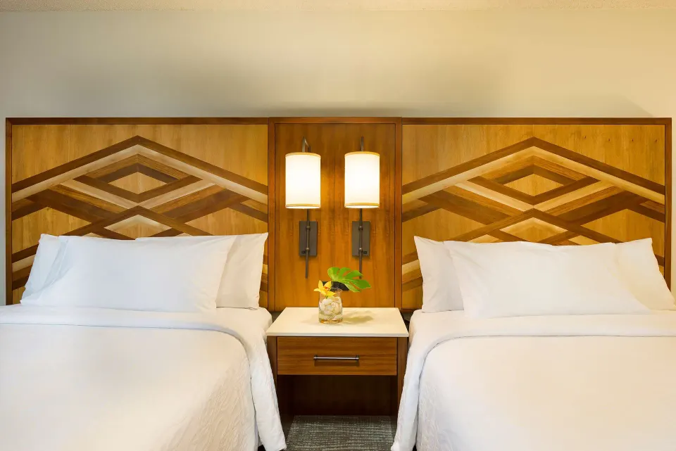 Accessible room two beds with shared nightstand at Hilton Garden Inn Kauai Wailua Bay.
