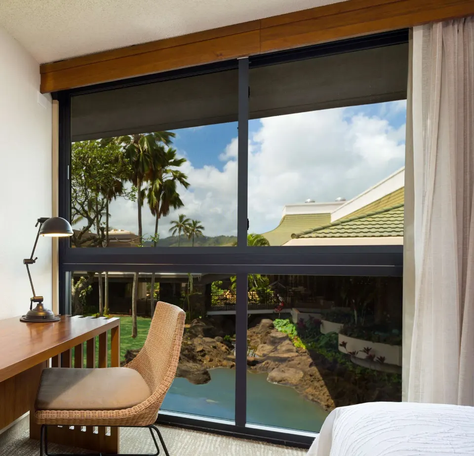 Accessible room window seating and courtyard view at Hilton Garden Inn Kauai Wailua Bay.