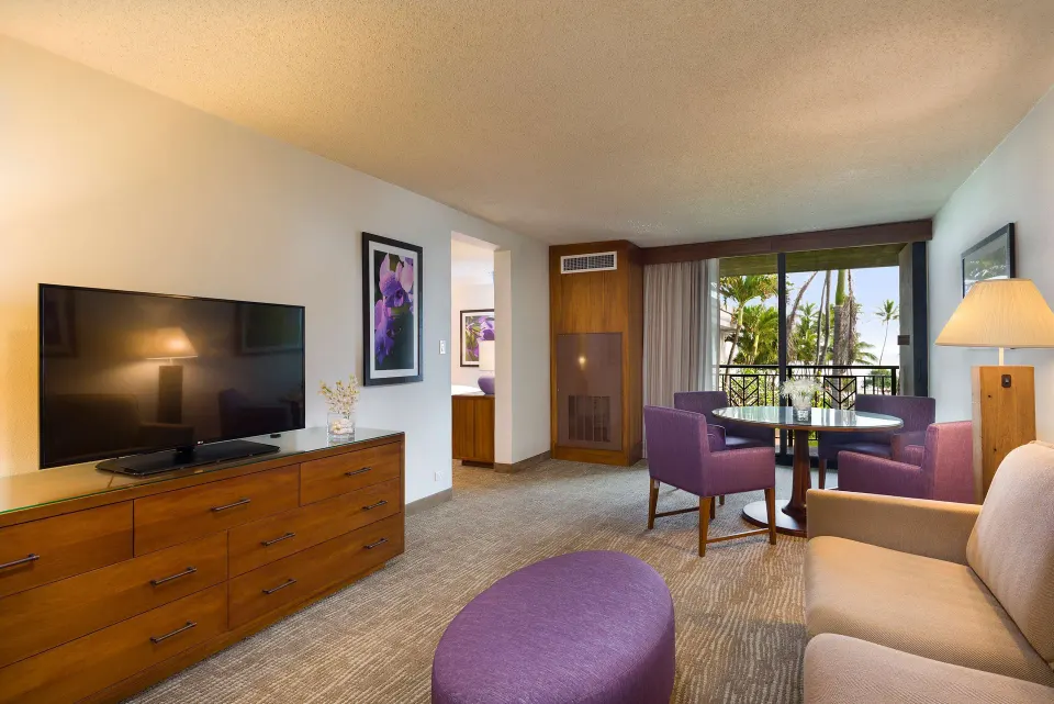 Accessible suite living area with balcony view at Hilton Garden Inn Kauai Wailua Bay.