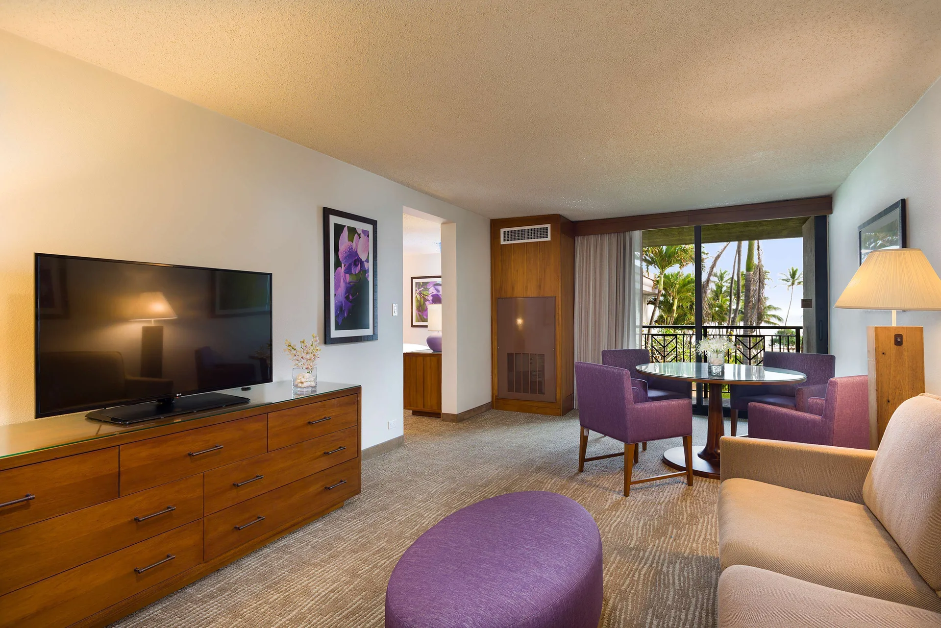 Accessible suite living area with balcony view at Hilton Garden Inn Kauai Wailua Bay.