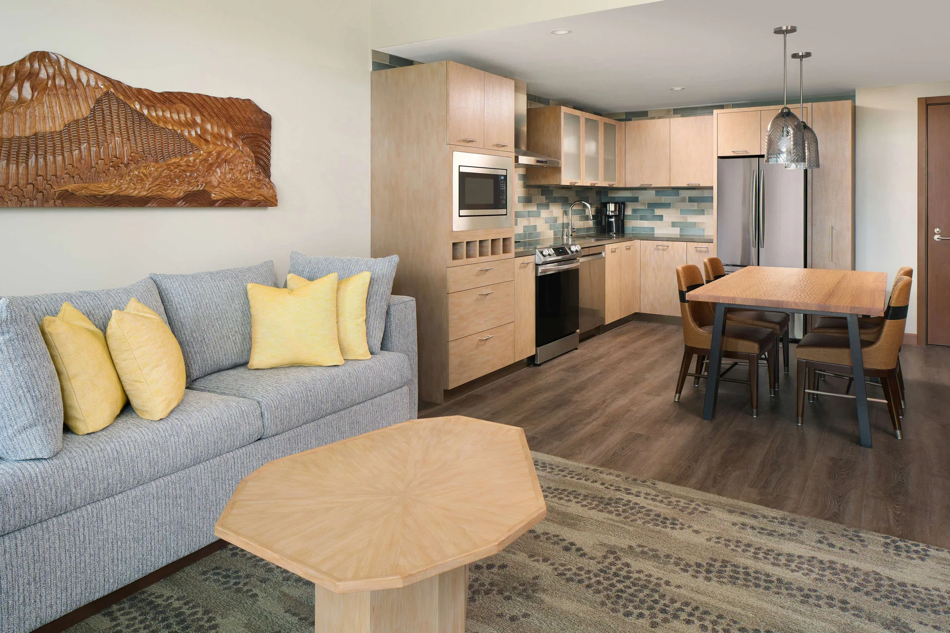 Living and kitchen area in a 1 bedroom resort view suite at Hilton Grand Vacations Club Maui Bay Villas.