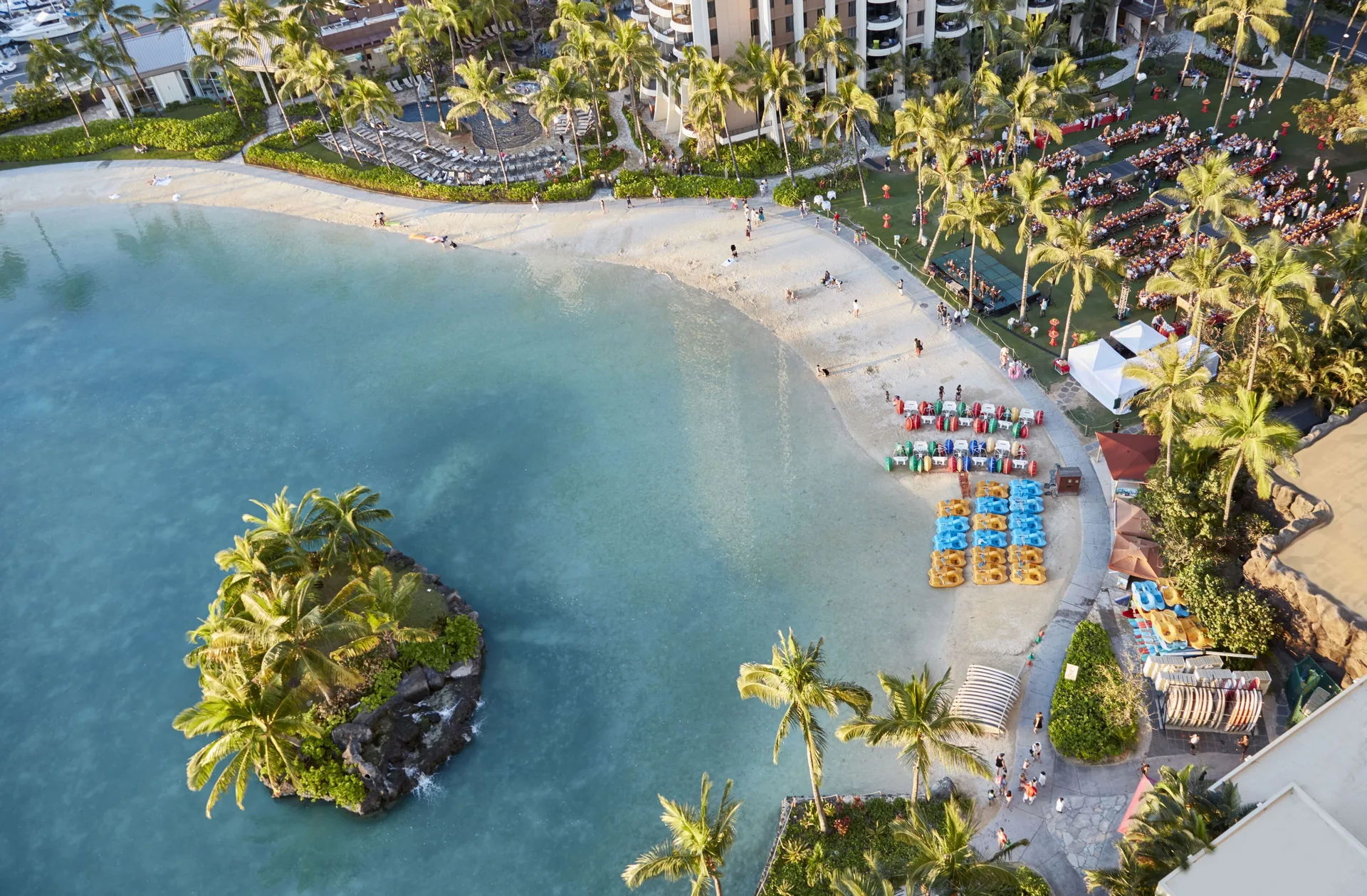Aerial view of the lagoon beach and luau lawn at Hilton Hawaiian Village Waikiki Beach Resort.