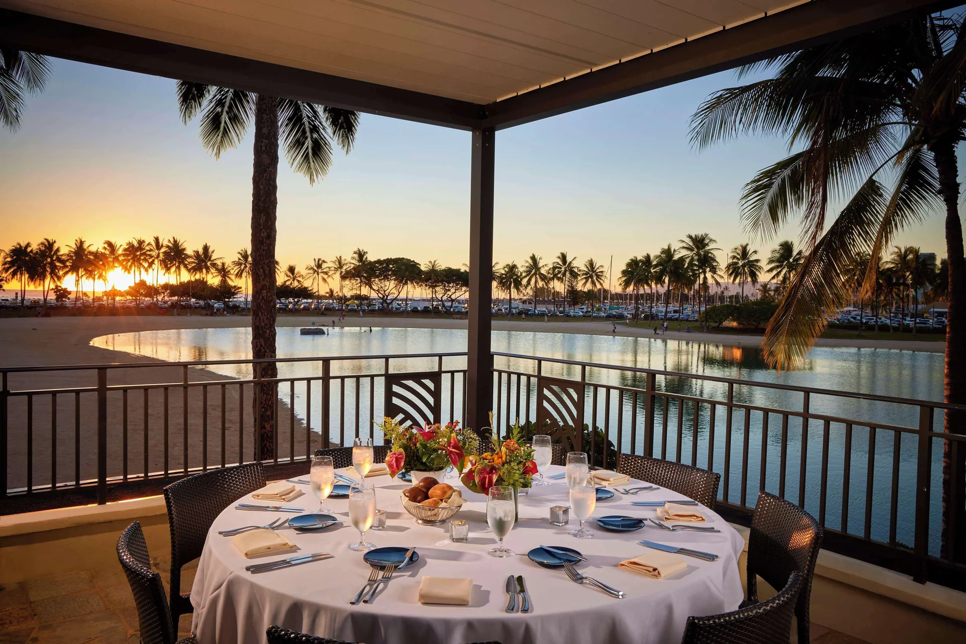 Lagoon-view private dining table at Hilton Hawaiian Village Waikiki Beach Resort.
