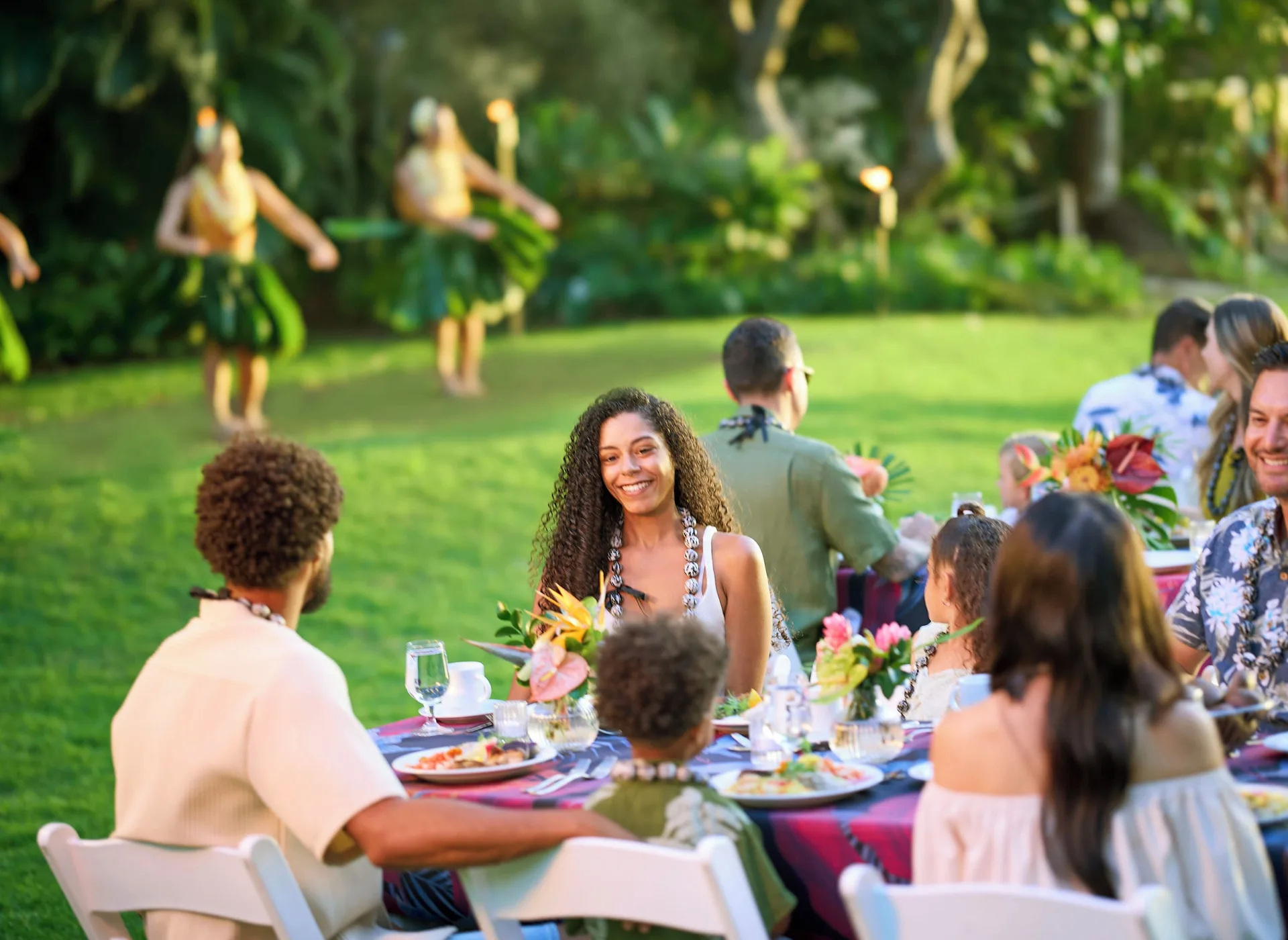 Outdoor luau dinner with hula dancers at Hilton Hawaiian Village Waikiki Beach Resort.