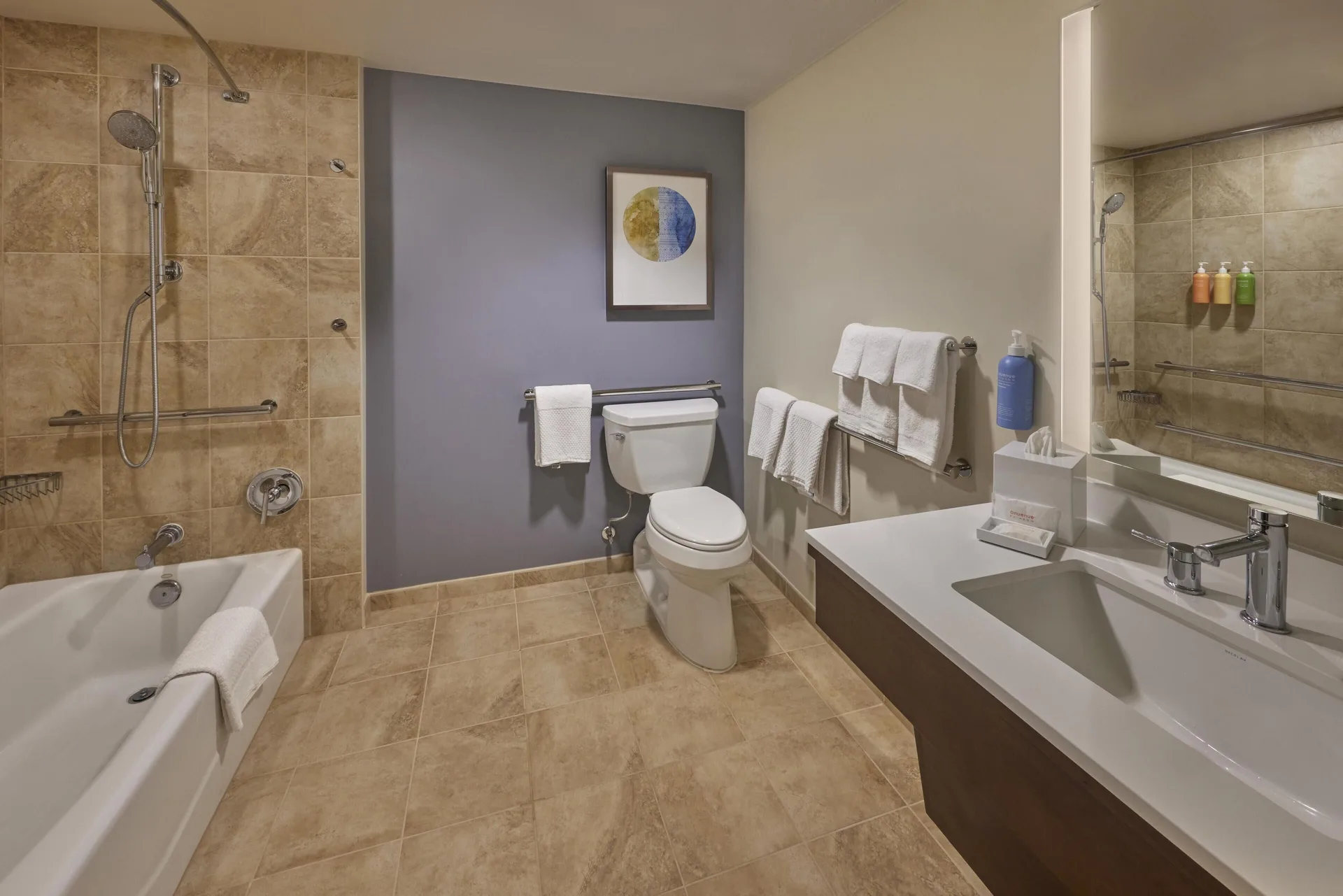 Accessible bathroom with tub and grab bars at Hilton Hawaiian Village Waikiki Beach Resort.