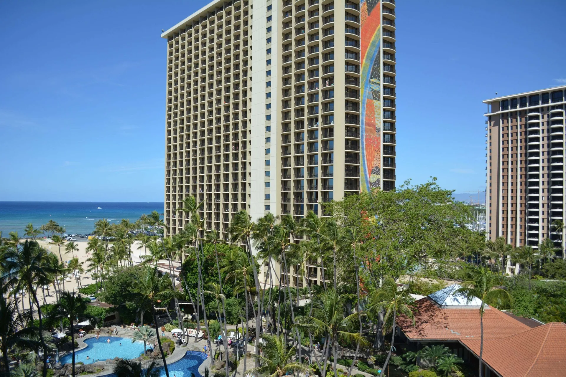 Ocean-view tower and pool scene from an accessible room at Hilton Hawaiian Village Waikiki Beach Resort.