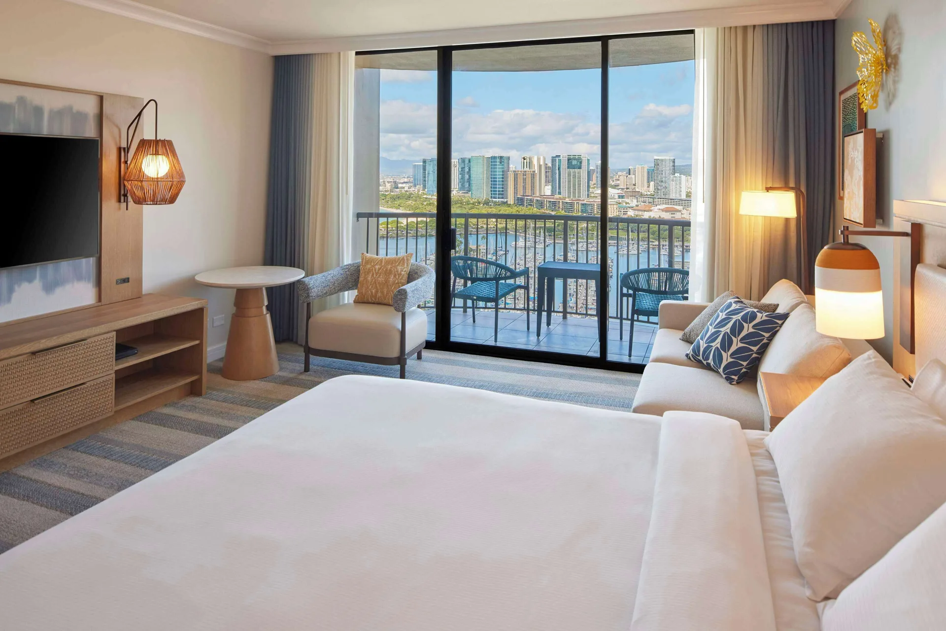 Ocean View room with king bed and balcony at Hilton Hawaiian Village Waikiki Beach Resort.