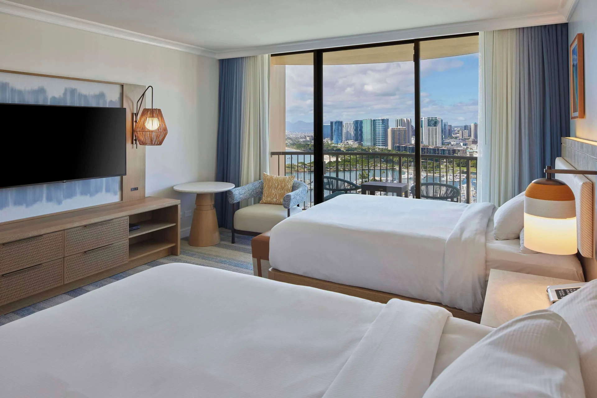 Ocean View room with two beds and marina view at Hilton Hawaiian Village Waikiki Beach Resort.