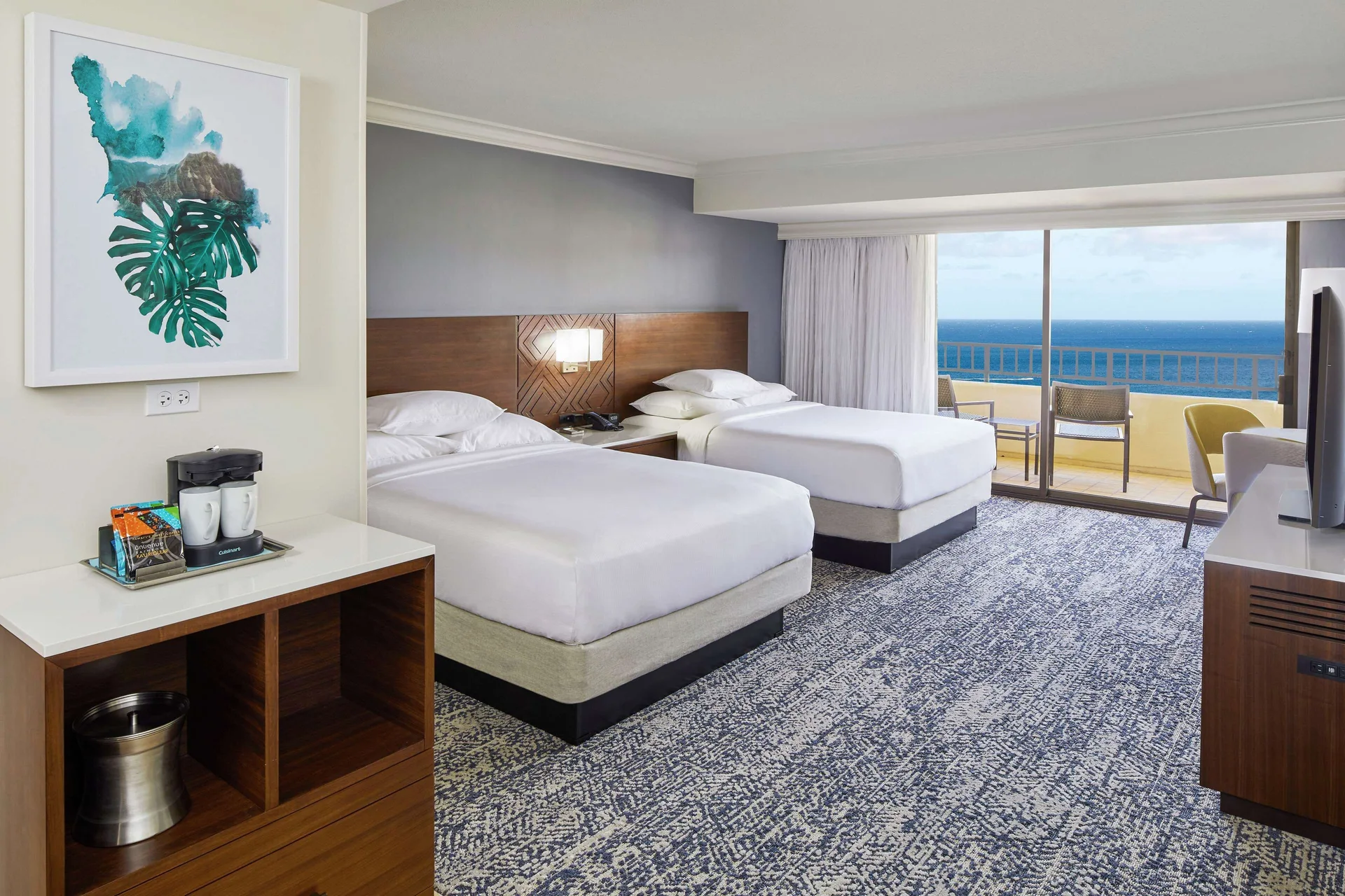 Two-bed Tapa Collection room with beverage station and ocean balcony at Hilton Hawaiian Village Waikiki Beach Resort.