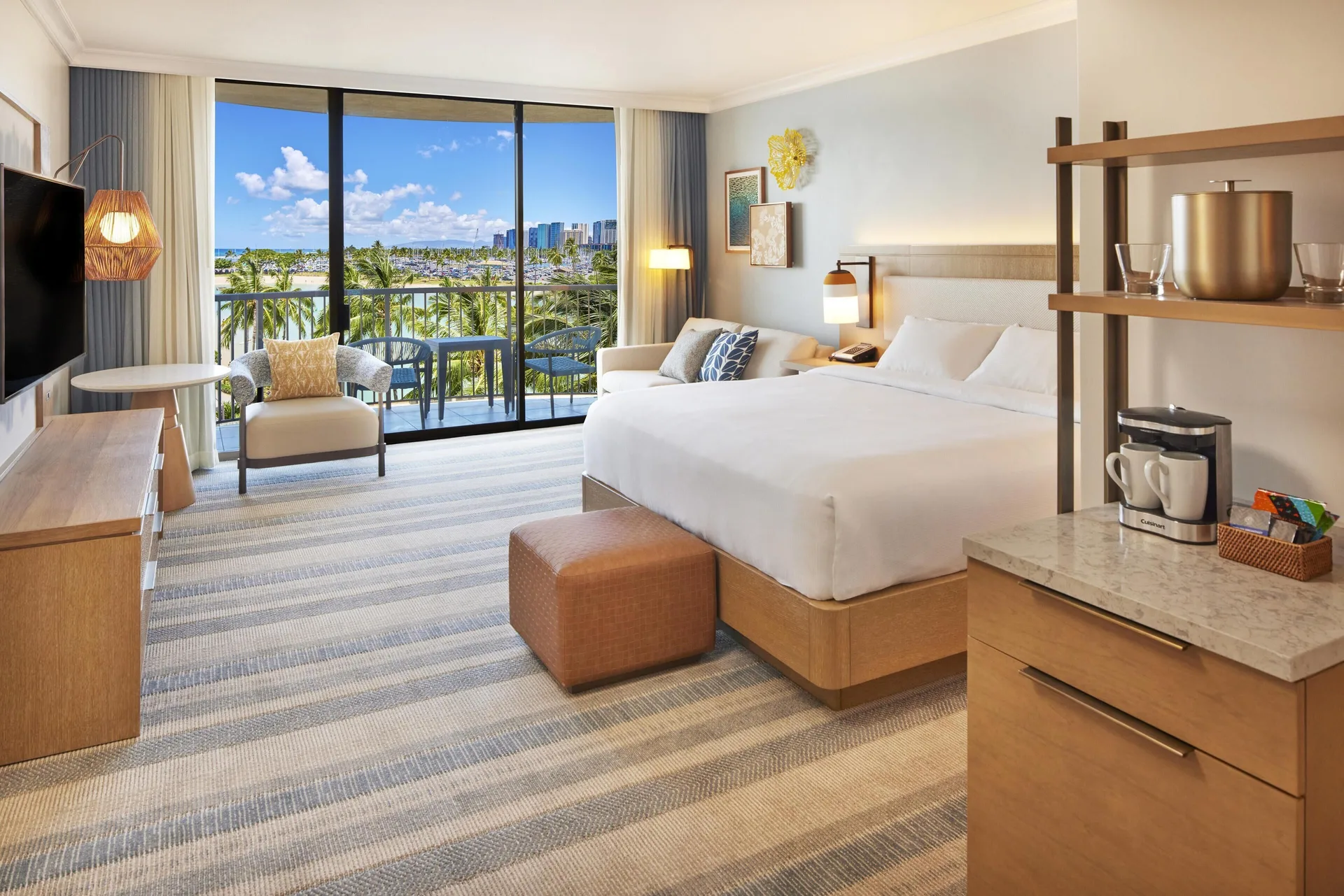 Renovated Rainbow Tower king room with lagoon-view balcony at Hilton Hawaiian Village Waikiki Beach Resort.