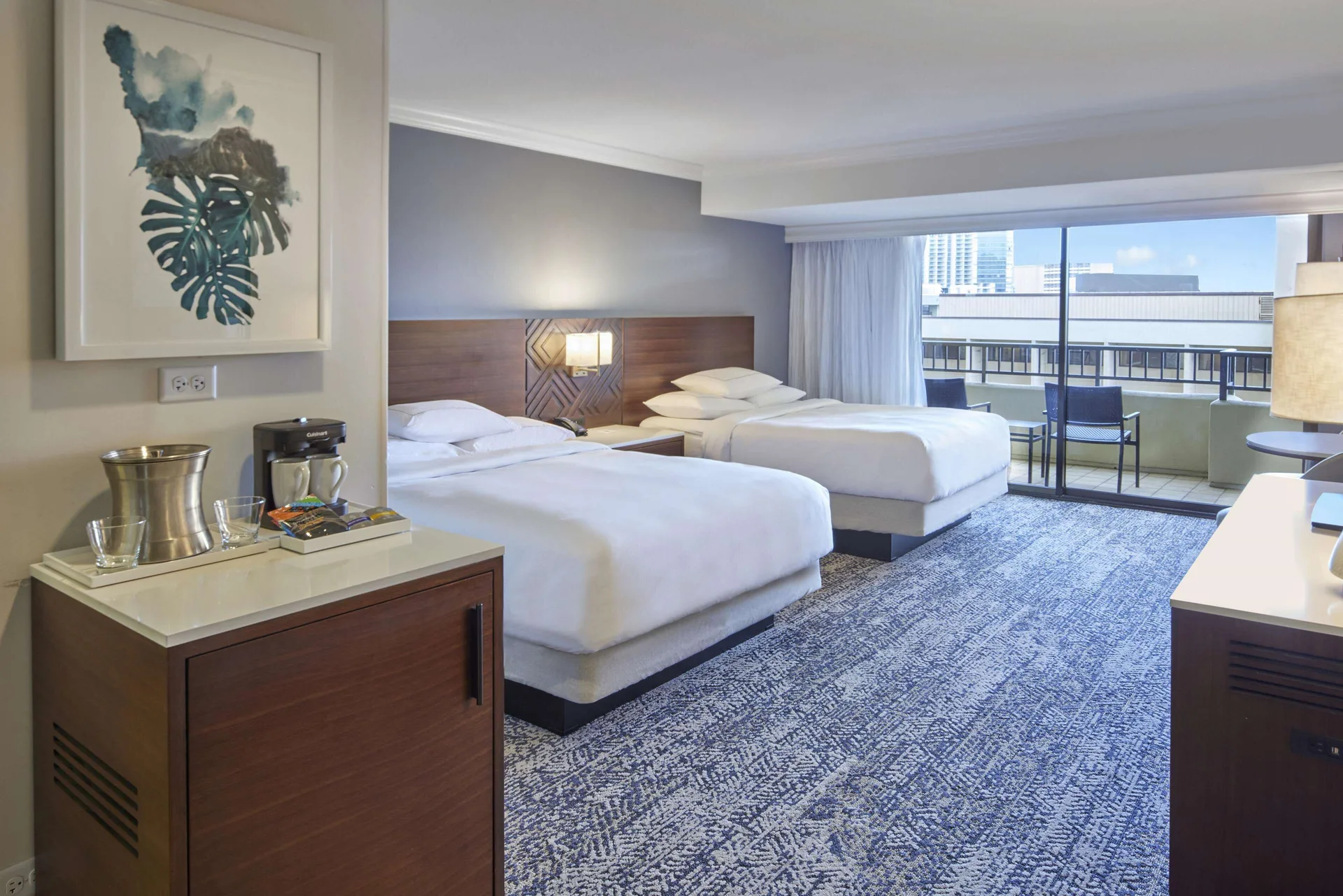 Two-bed resort view room with balcony at Hilton Hawaiian Village Waikiki Beach Resort.