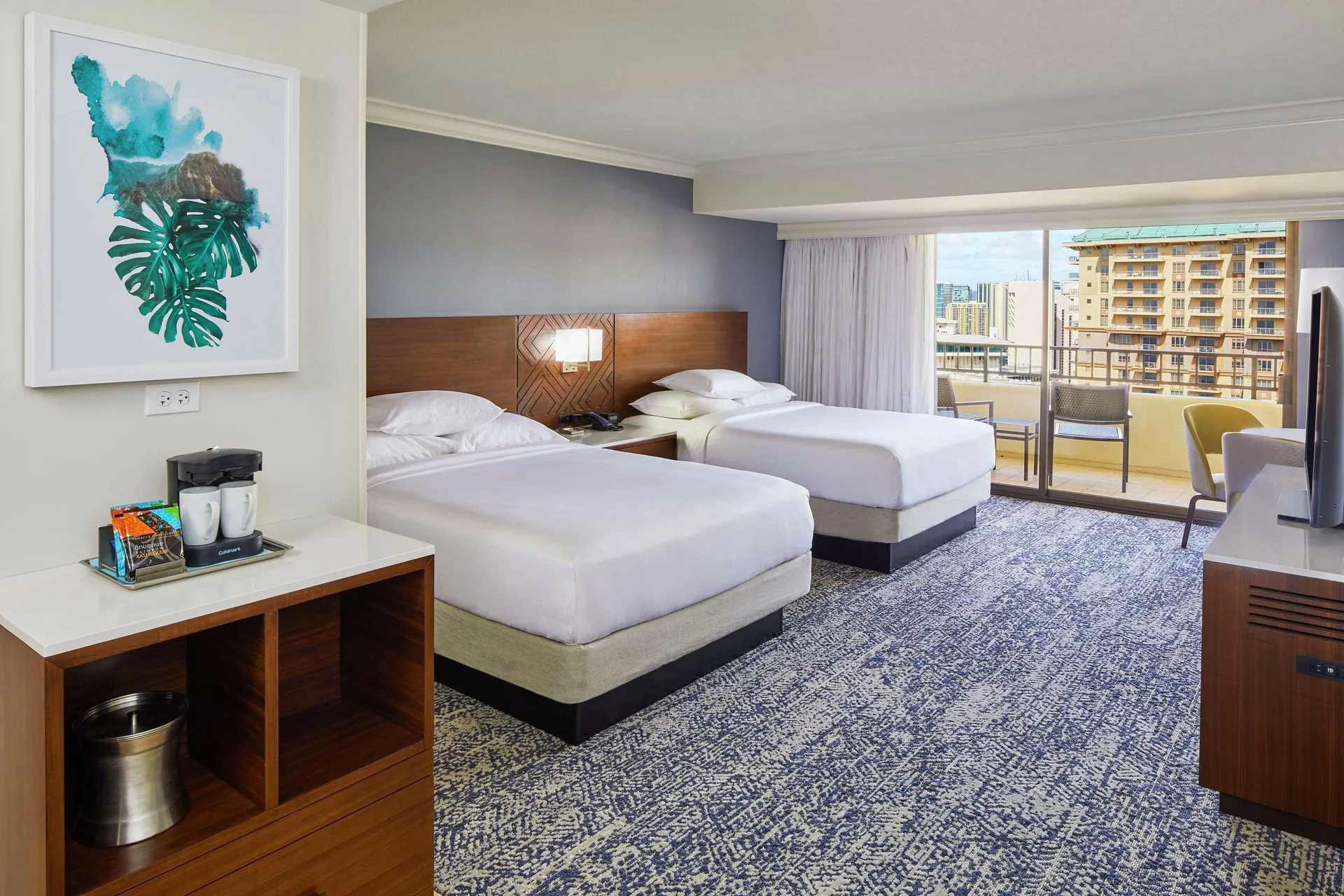 Two-bed resort view room with balcony at Hilton Hawaiian Village Waikiki Beach Resort.