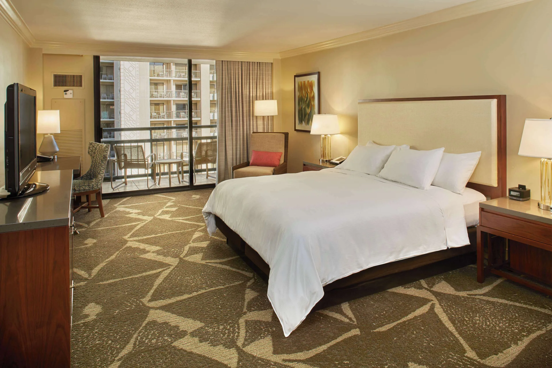 King room with balcony and neighboring tower view at Hilton Hawaiian Village Waikiki Beach Resort.
