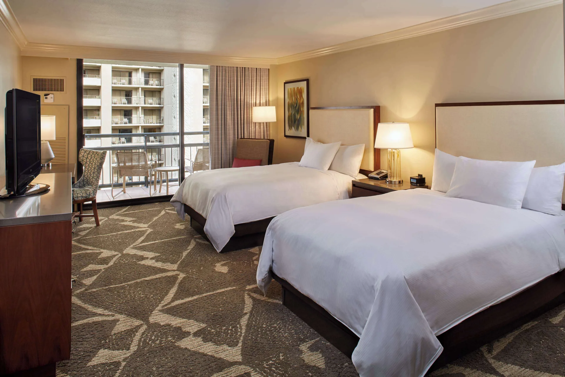Two-bed resort view guest room with balcony at Hilton Hawaiian Village Waikiki Beach Resort.