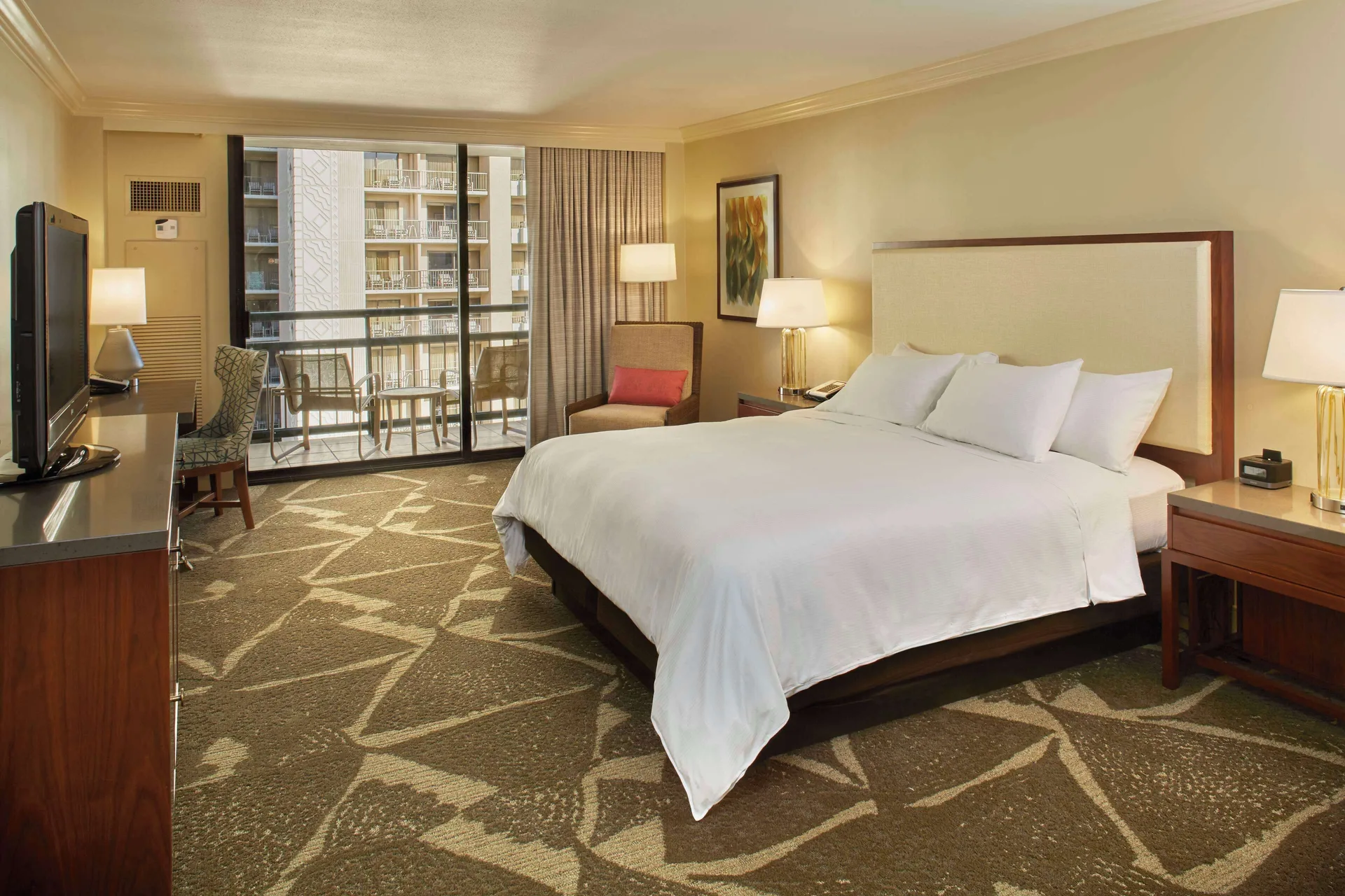 King-bed resort view guest room with balcony at Hilton Hawaiian Village Waikiki Beach Resort.