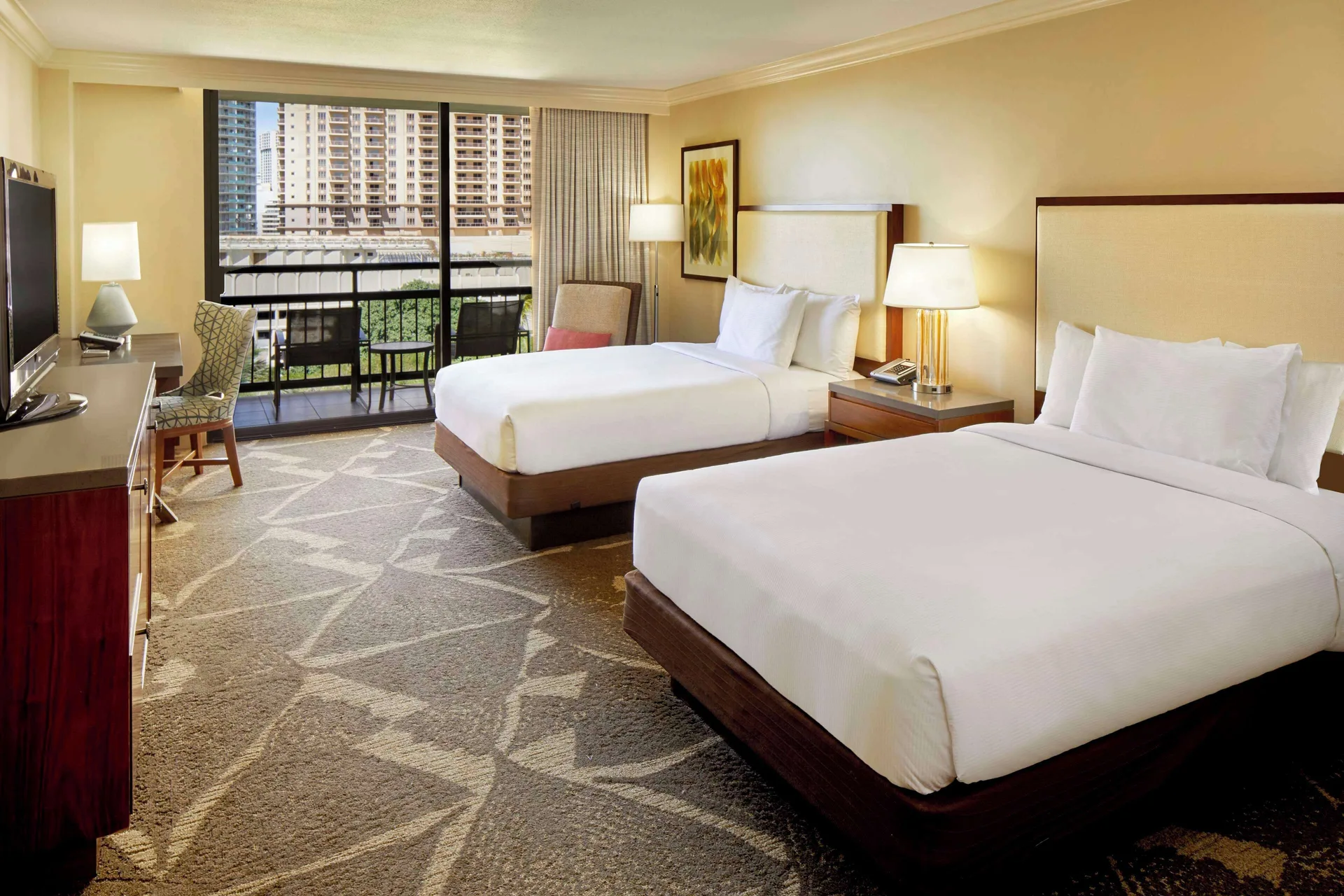 Two-bed resort view guest room with balcony at Hilton Hawaiian Village Waikiki Beach Resort.