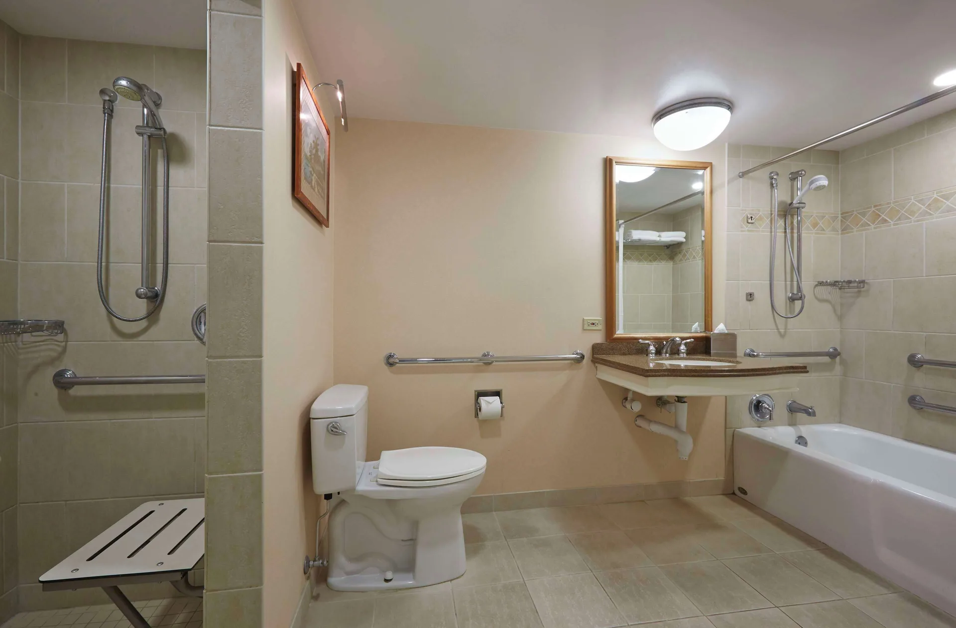 Accessible bathroom with roll-in shower and tub at Hilton Hawaiian Village Waikiki Beach Resort.