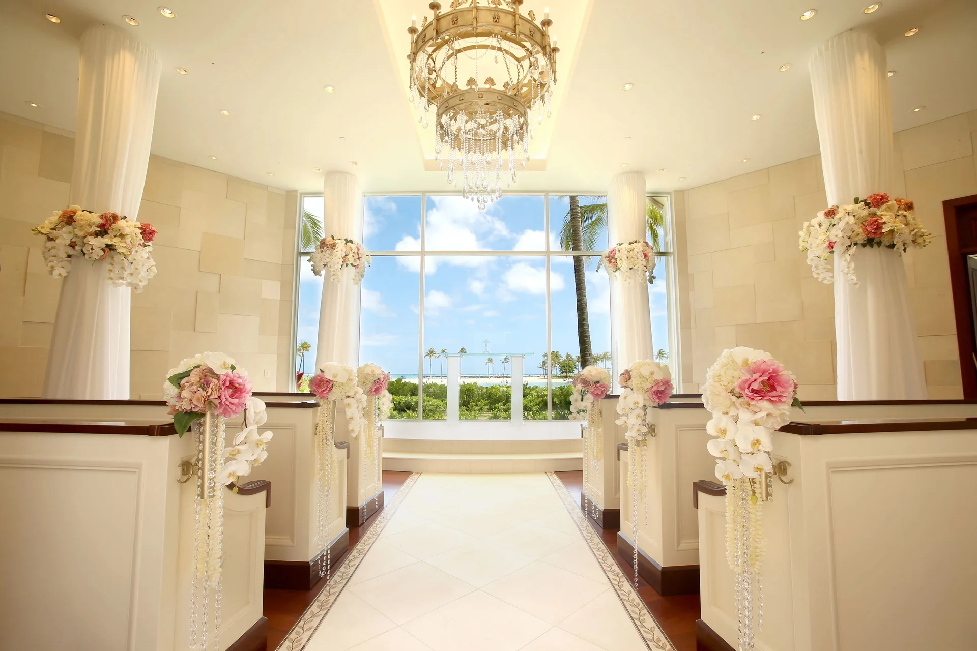 Wedding chapel aisle with floral decorations at Hilton Hawaiian Village Waikiki Beach Resort.