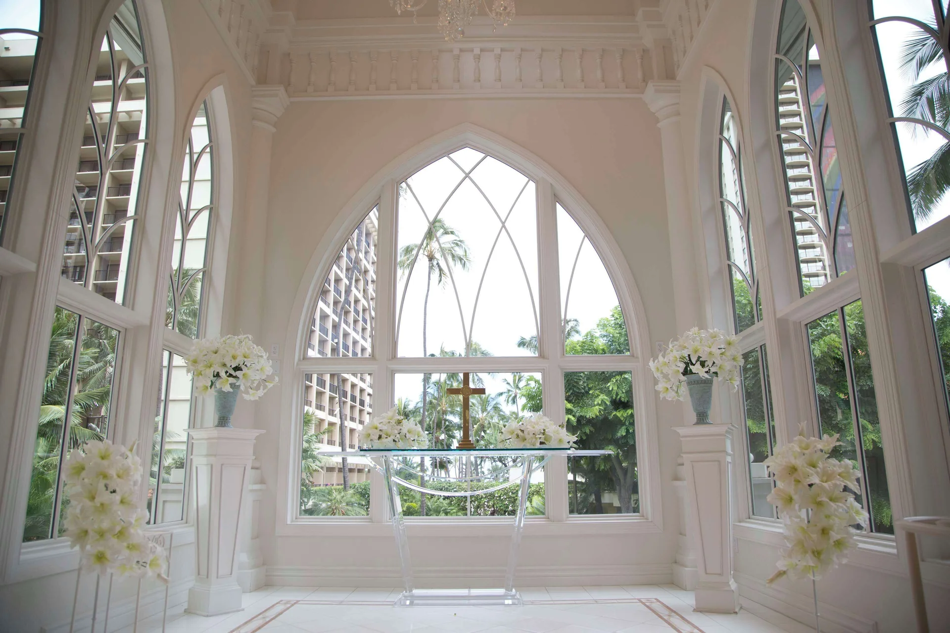 White wedding chapel with arched windows at Hilton Hawaiian Village Waikiki Beach Resort.
