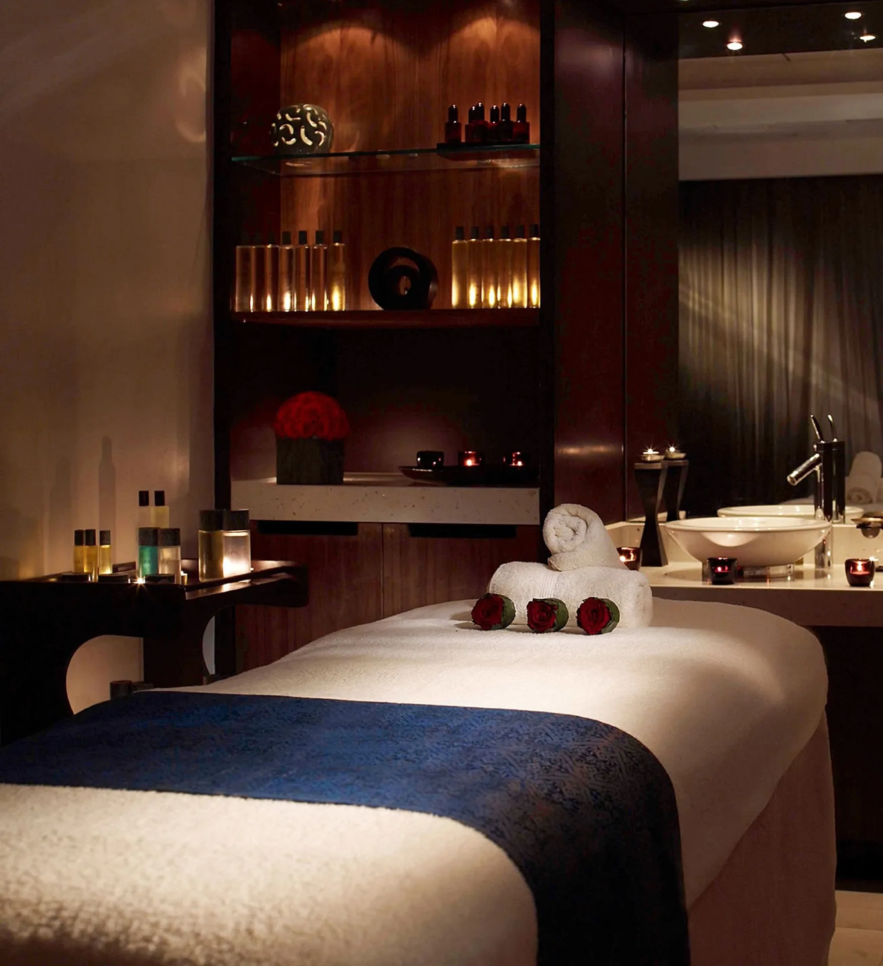Spa massage table with candles and roses at Hilton Trinidad & Conference Centre.