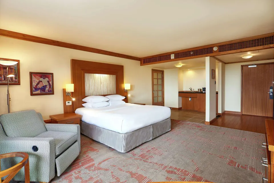 Accessible room with king bed and entry area at Hilton Trinidad & Conference Centre.