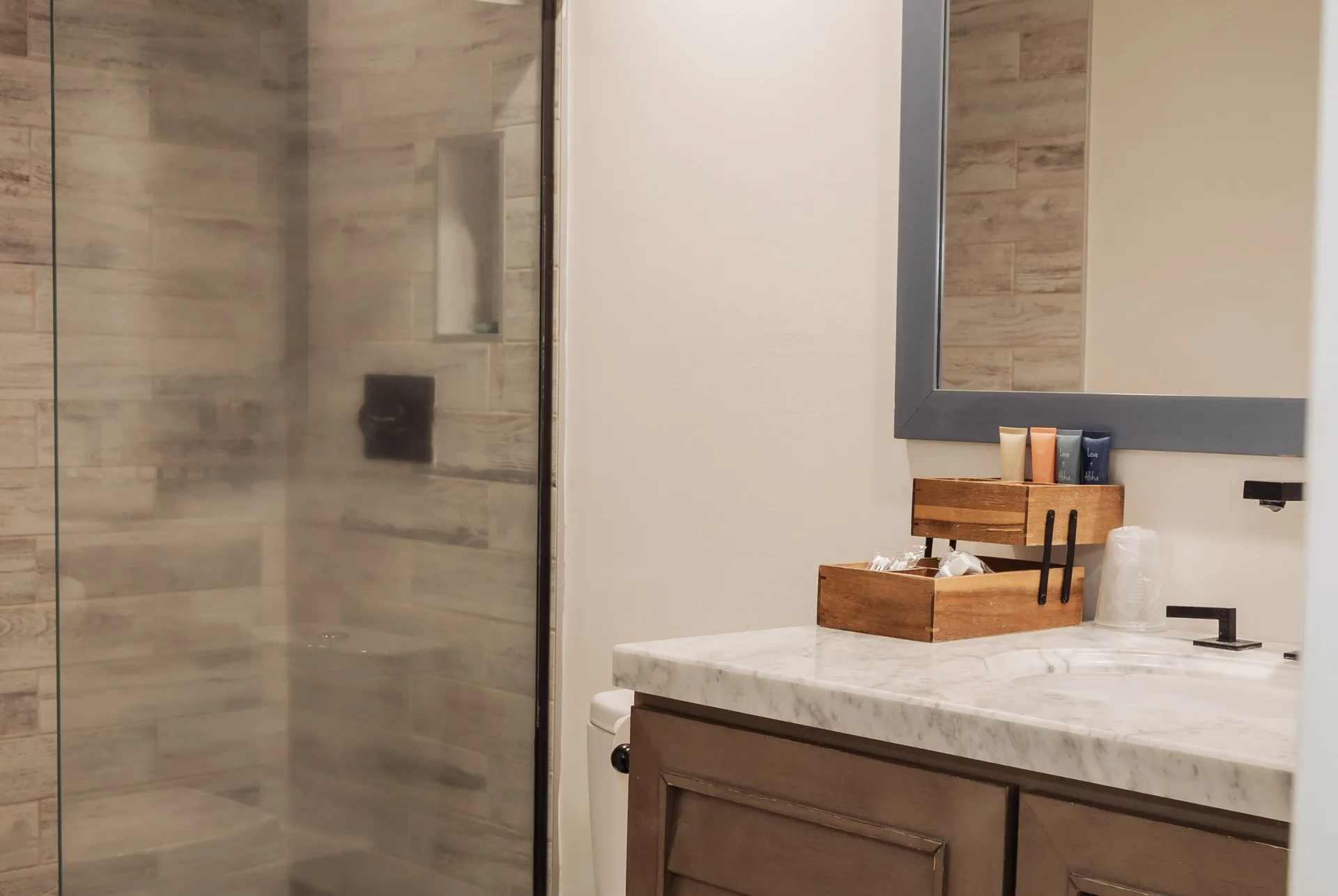 Penthouse Hoku Terrace ADA bathroom vanity and glass shower at Hotel La Croix.