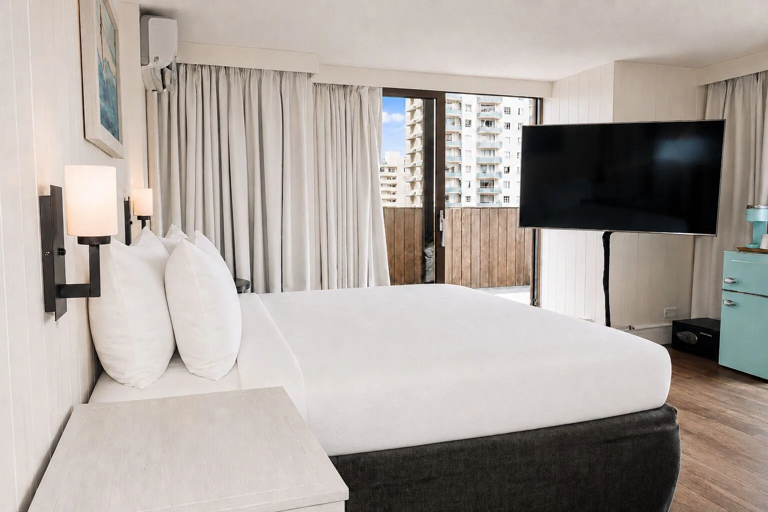 Penthouse Hoku Terrace ADA king bed with terrace doors at Hotel La Croix.