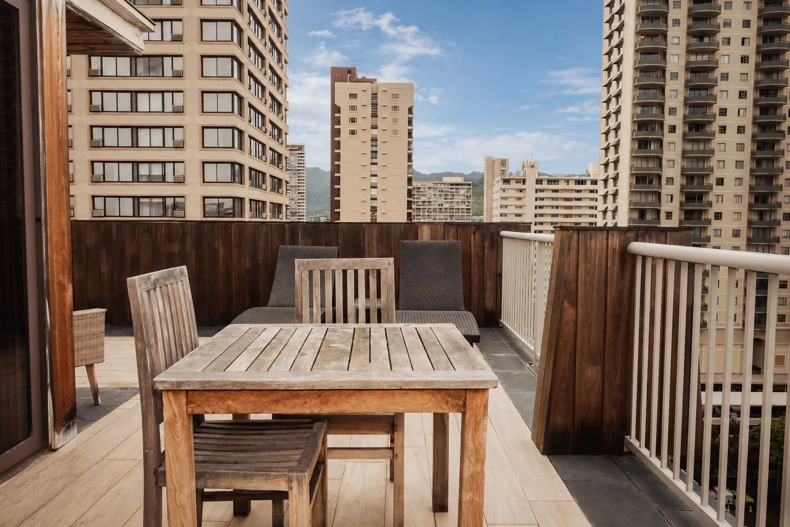 Penthouse Hoku Terrace ADA patio table and lounge chairs at Hotel La Croix.