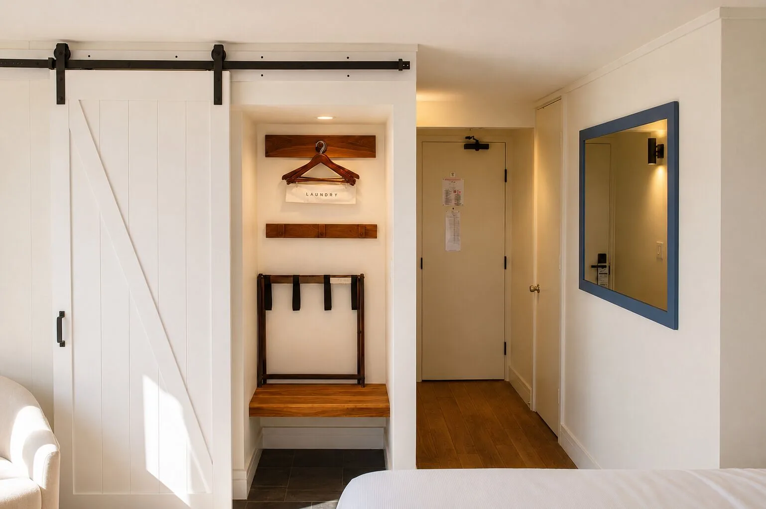 Penthouse Hoku Terrace entry area at Hotel La Croix with barn door, bench, mirror and room door.