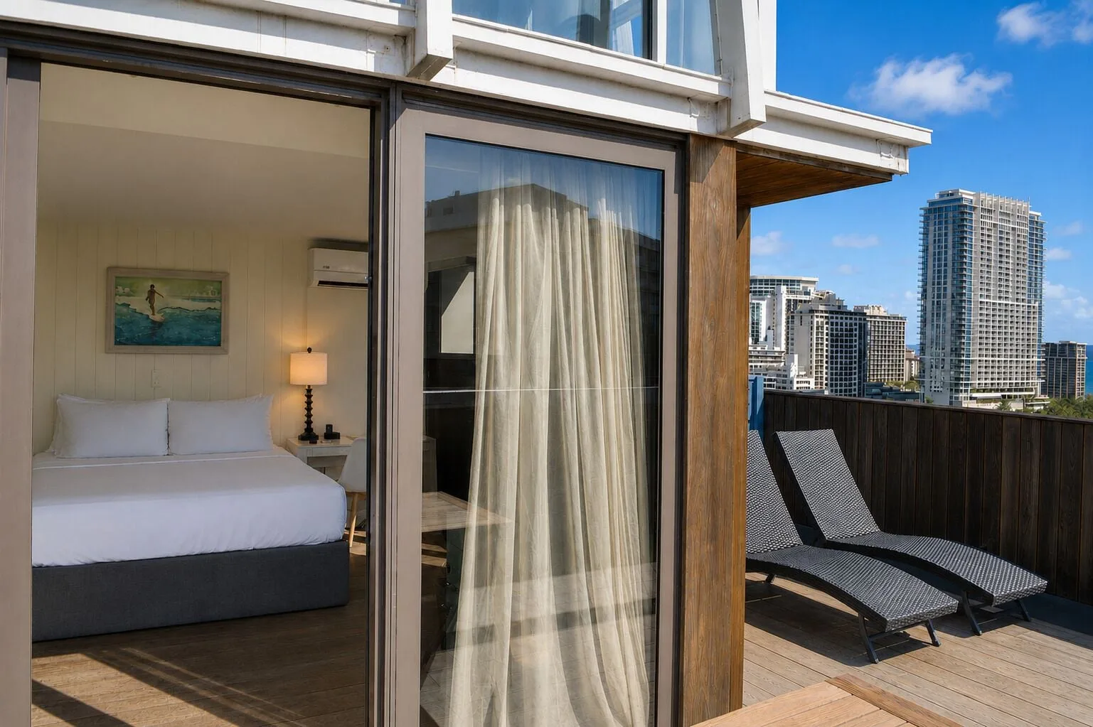 Private terrace with lounge chairs beside the king bedroom at Hotel La Croix.