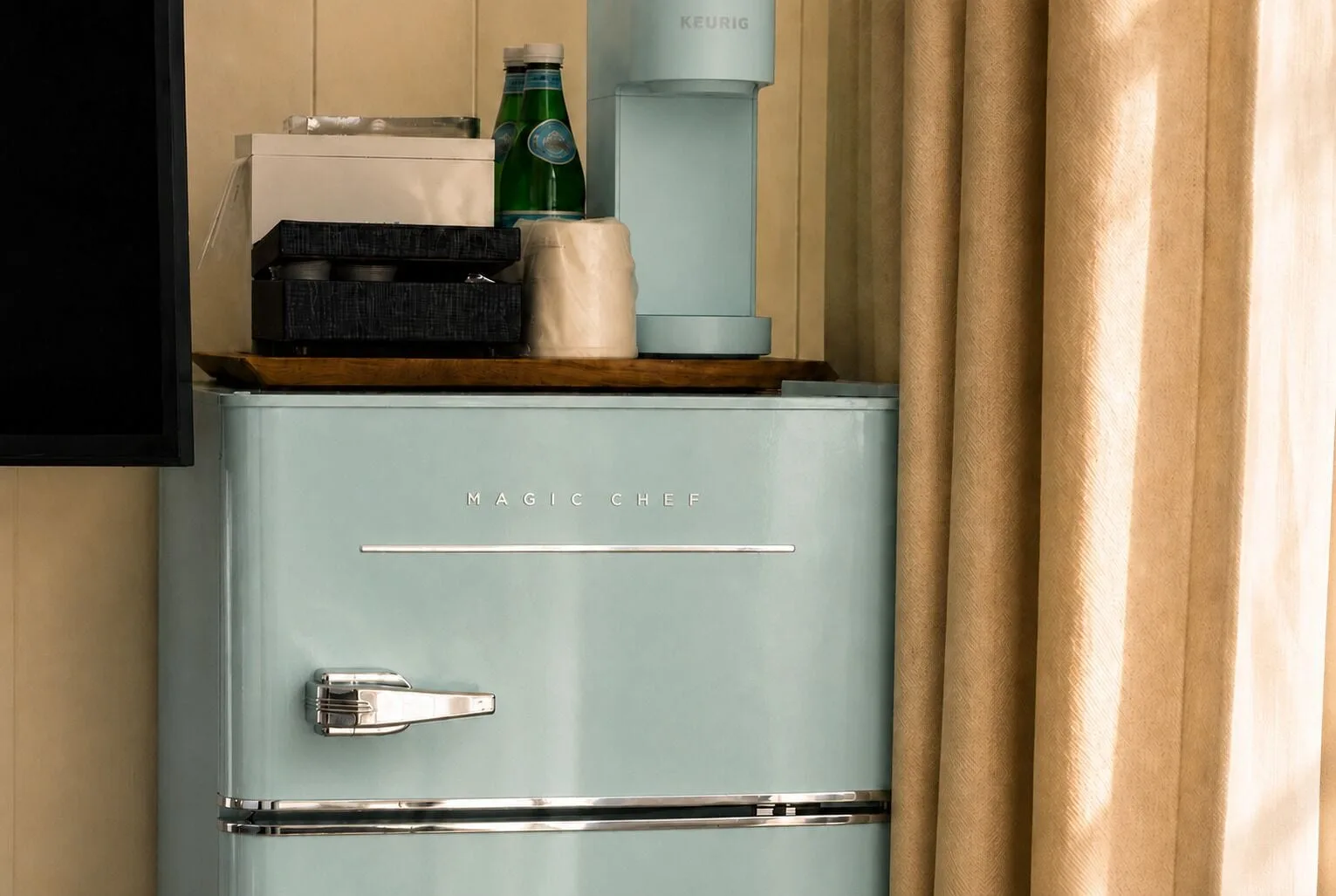 In-room mini refrigerator and coffee setup in the Penthouse Hoku Terrace at Hotel La Croix.