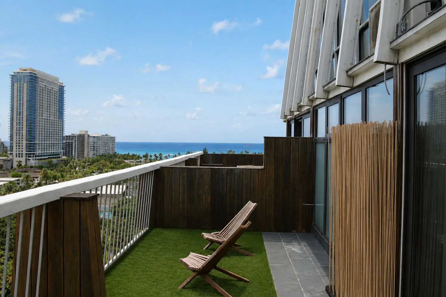 Penthouse Hoku Terrace Oceanview terrace with lounge chairs and ocean view at Hotel La Croix.