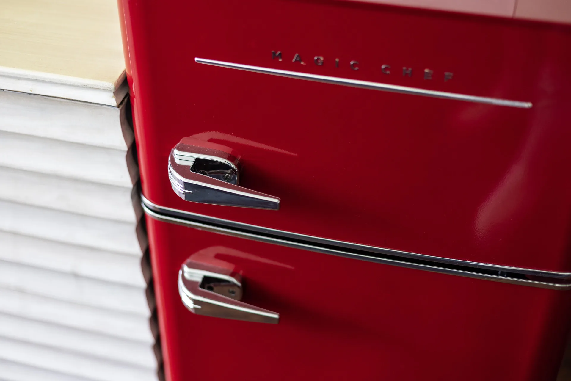 Red mini refrigerator in a Premium Kalakaua Haus Corner Two Lanai room at Hotel La Croix.
