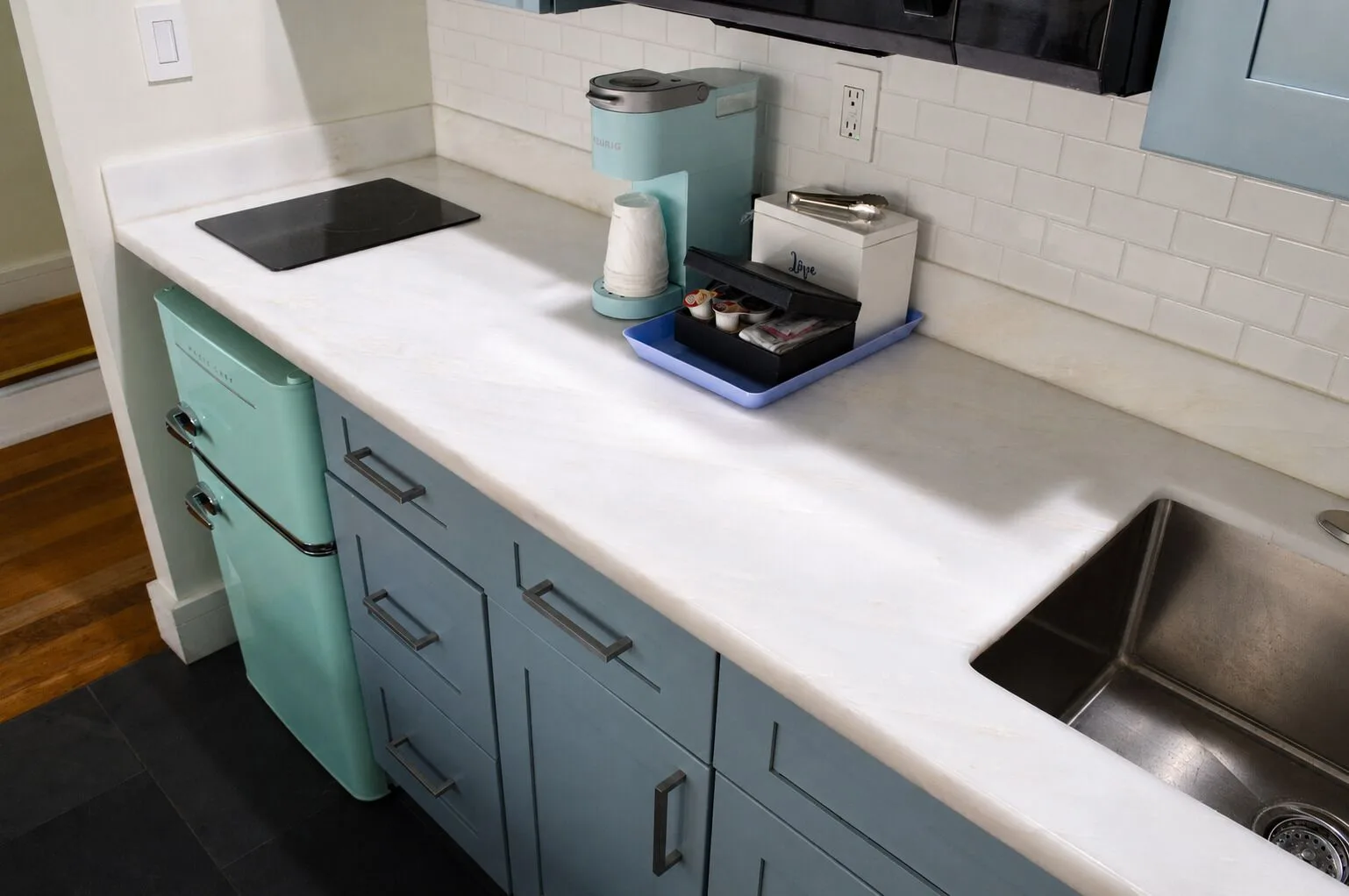 Premium Kalakaua Haus Kitchenette counter with sink, coffee maker and mini fridge at Hotel La Croix.