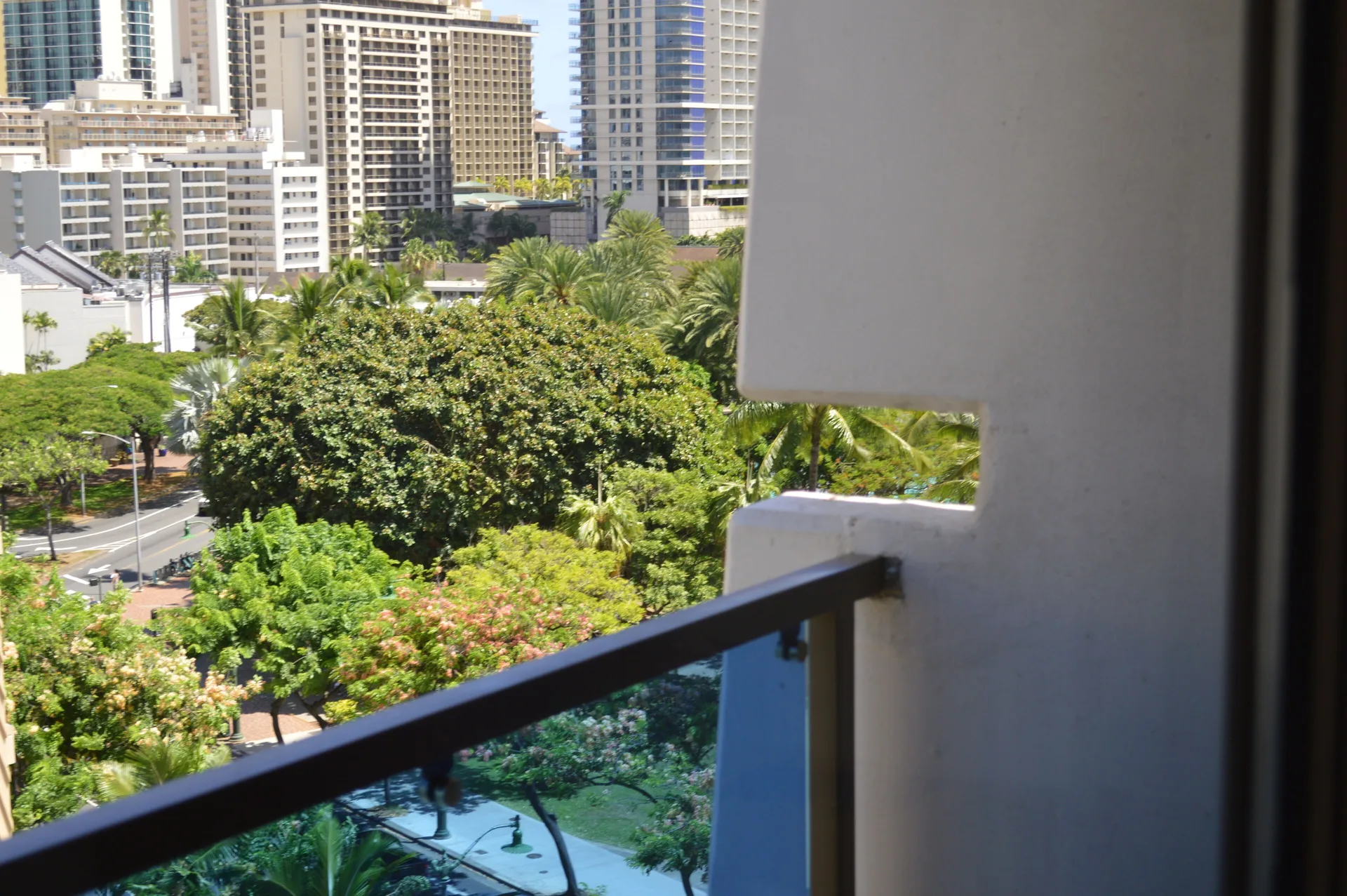 Premium Kalakaua Haus Oceanview room lanai side view of city towers and trees at Hotel La Croix.