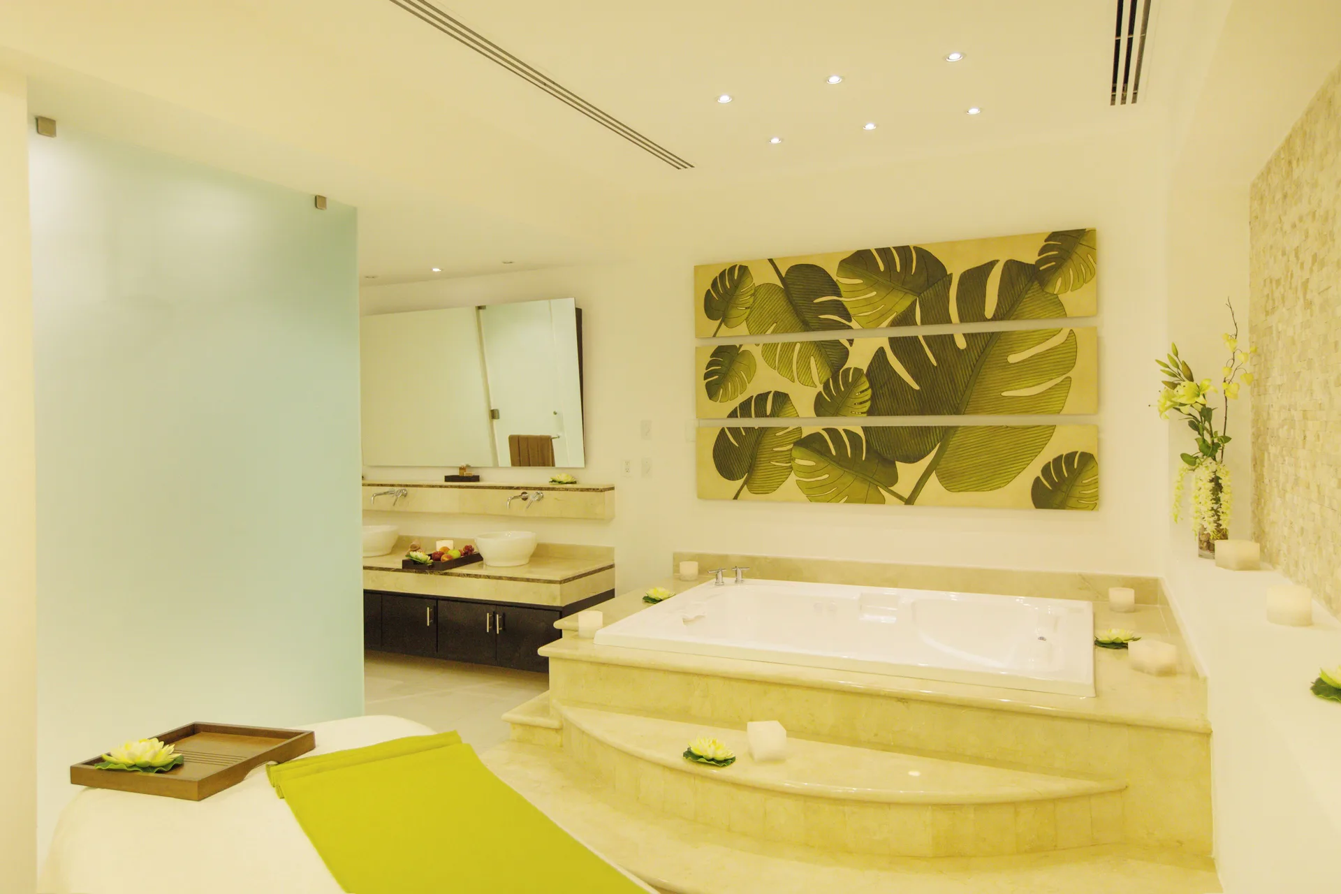Bright spa treatment room with a soaking tub at Hotel Marina El Cid Spa & Beach Resort.