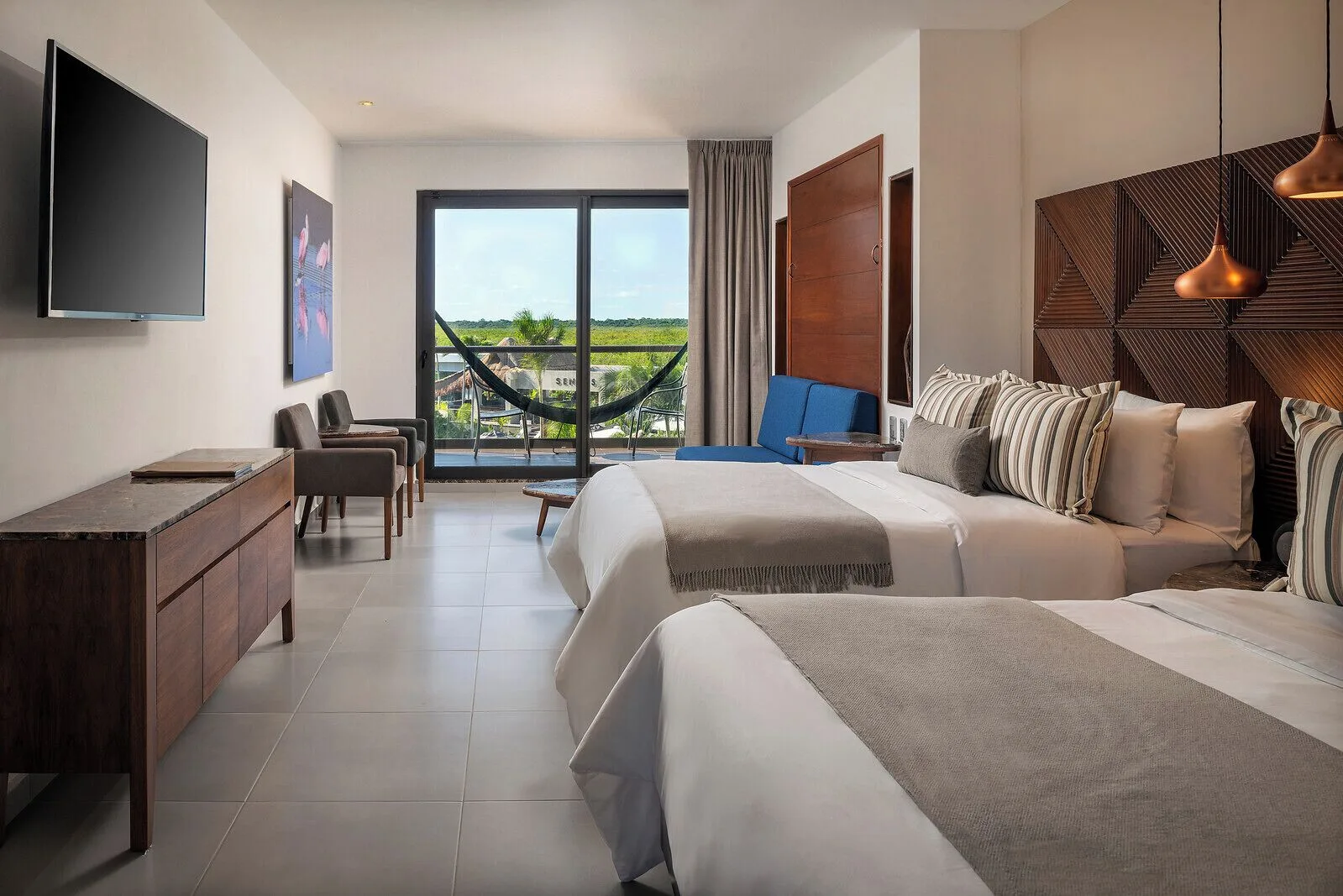 Family Room with two beds and balcony at Hotel Marina El Cid Spa & Beach Resort.