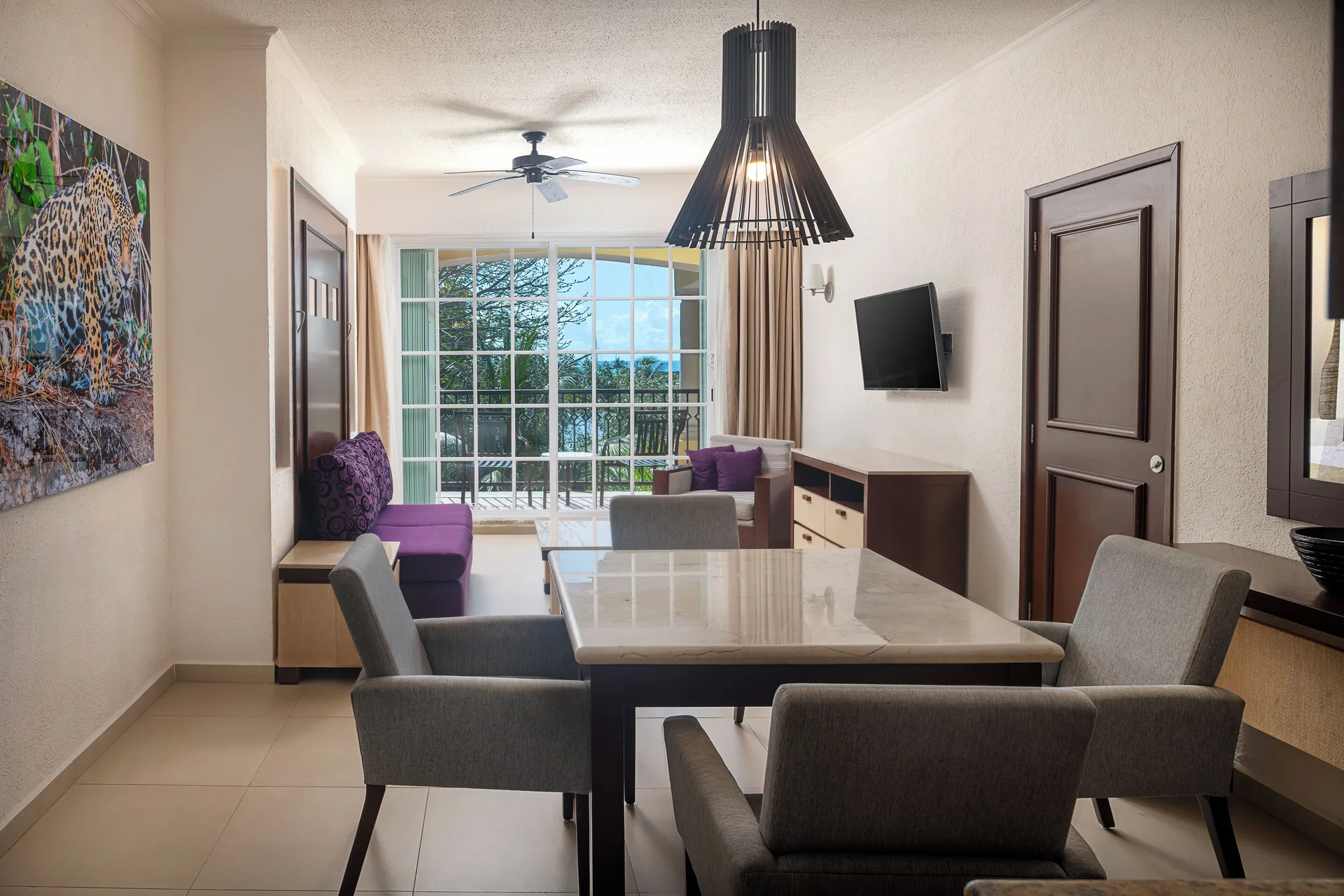 One Bedroom Suite living and dining area at Hotel Marina El Cid Spa & Beach Resort.