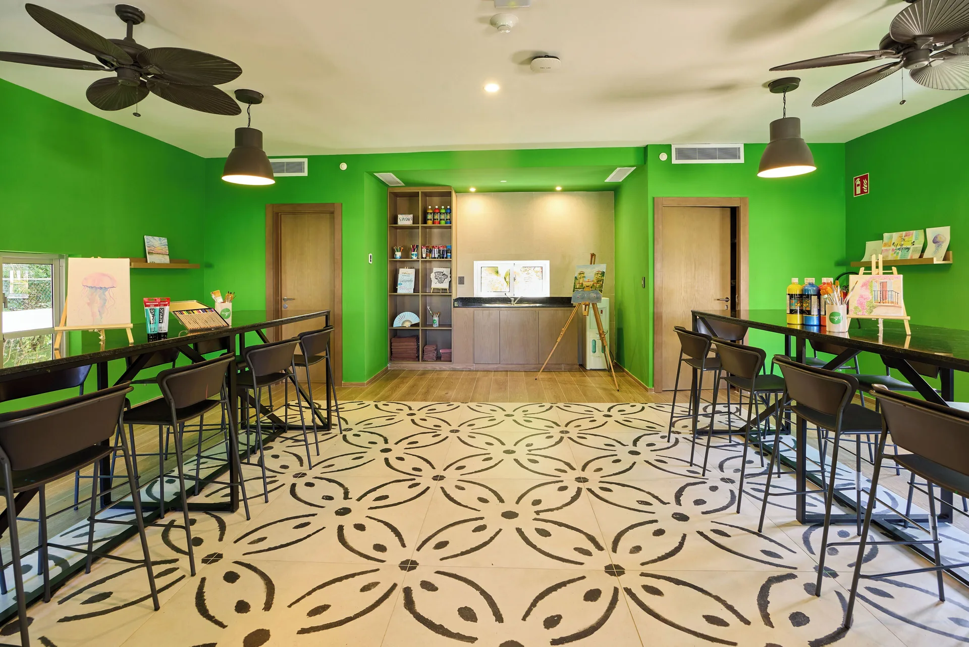 Bright art activity room with easels and high tables at Hotel Riu Guanacaste.