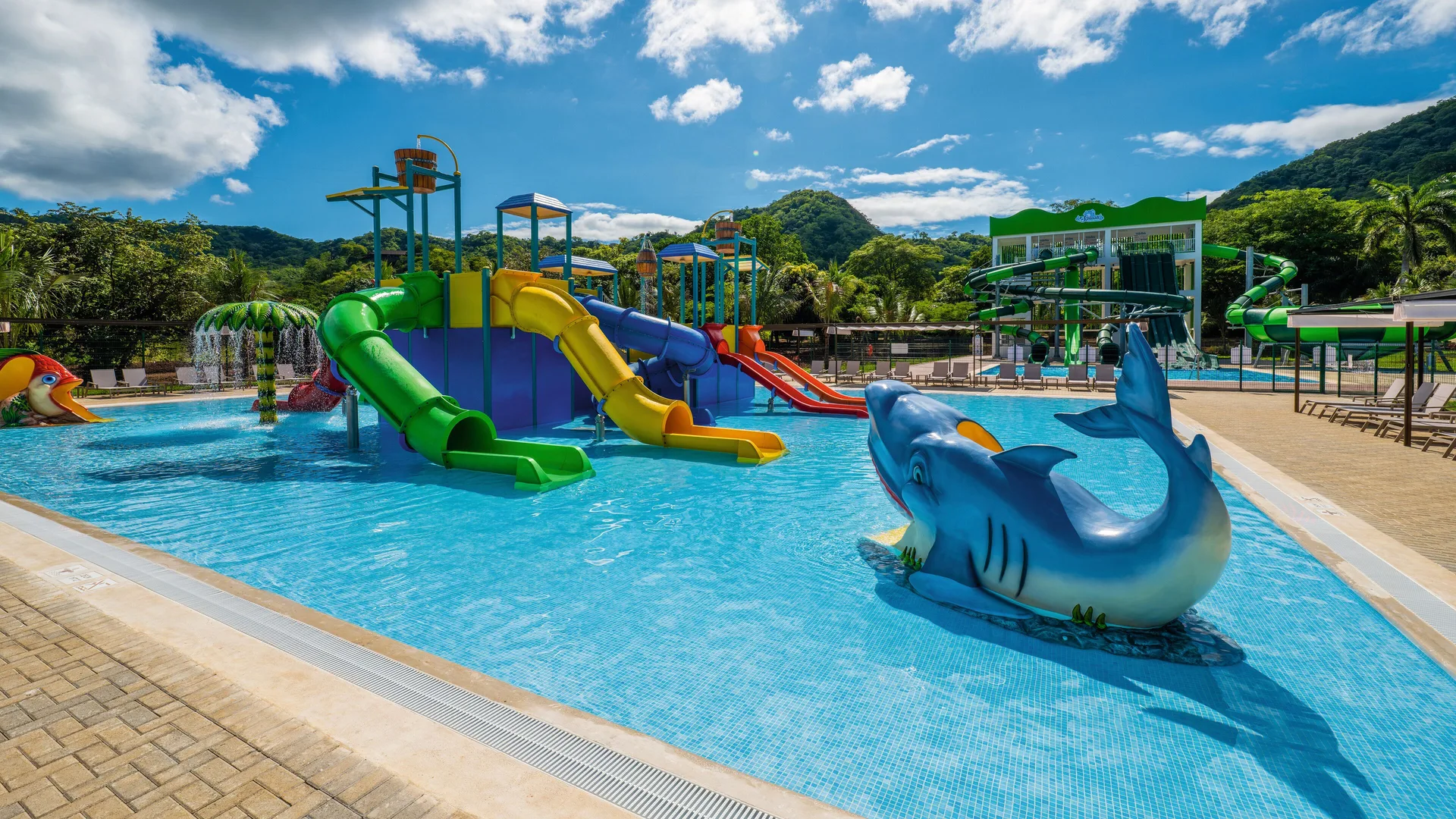 Shallow pool with animal figures and slides at Hotel Riu Guanacaste.