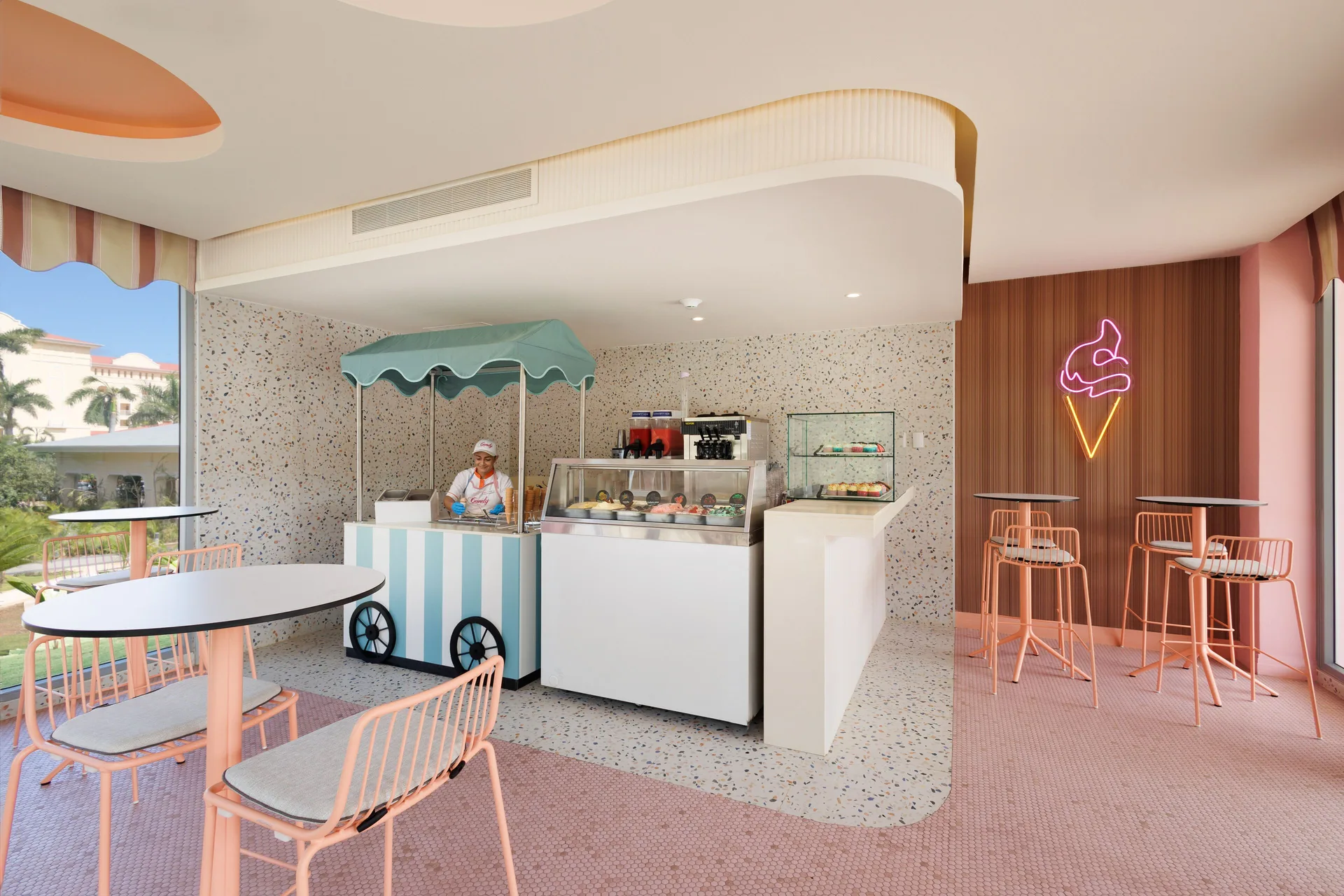 Pastel ice cream café with display cases and seating at Hotel Riu Guanacaste.