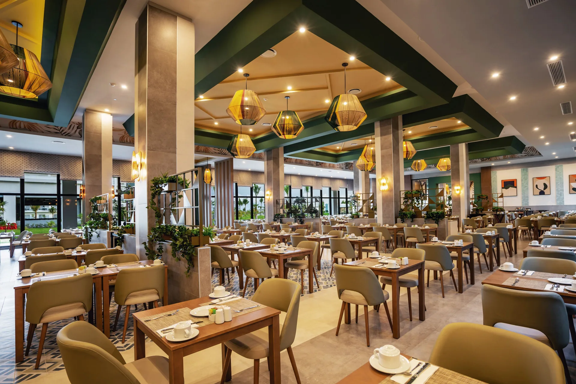 Spacious buffet dining room with set tables at Hotel Riu Latino.