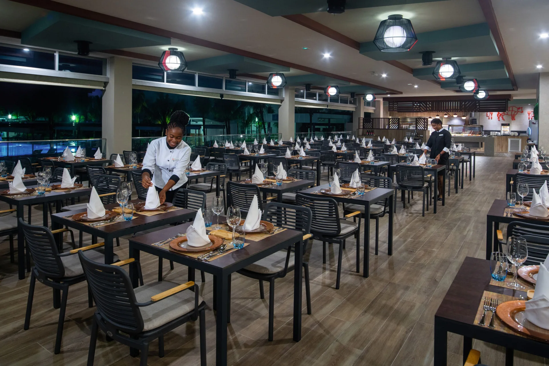 Steakhouse dining room with rows of set tables at Hotel Riu Montego Bay.